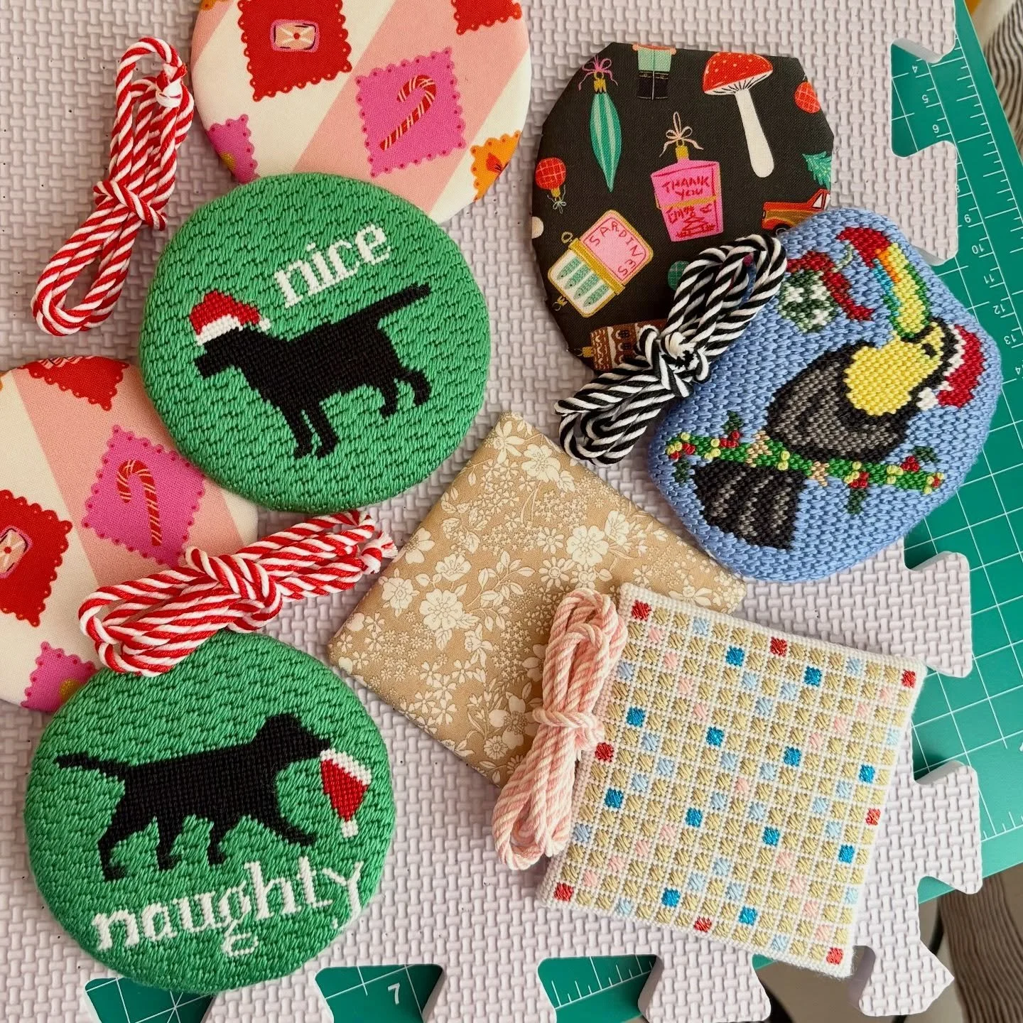 Having so much fun with this batch of ornaments for @my.so.called.stitches - the holiday toucan was added to my wishlist instantly. All backing fabrics from @crimsontate. #needlepointfinisher #ndlpt