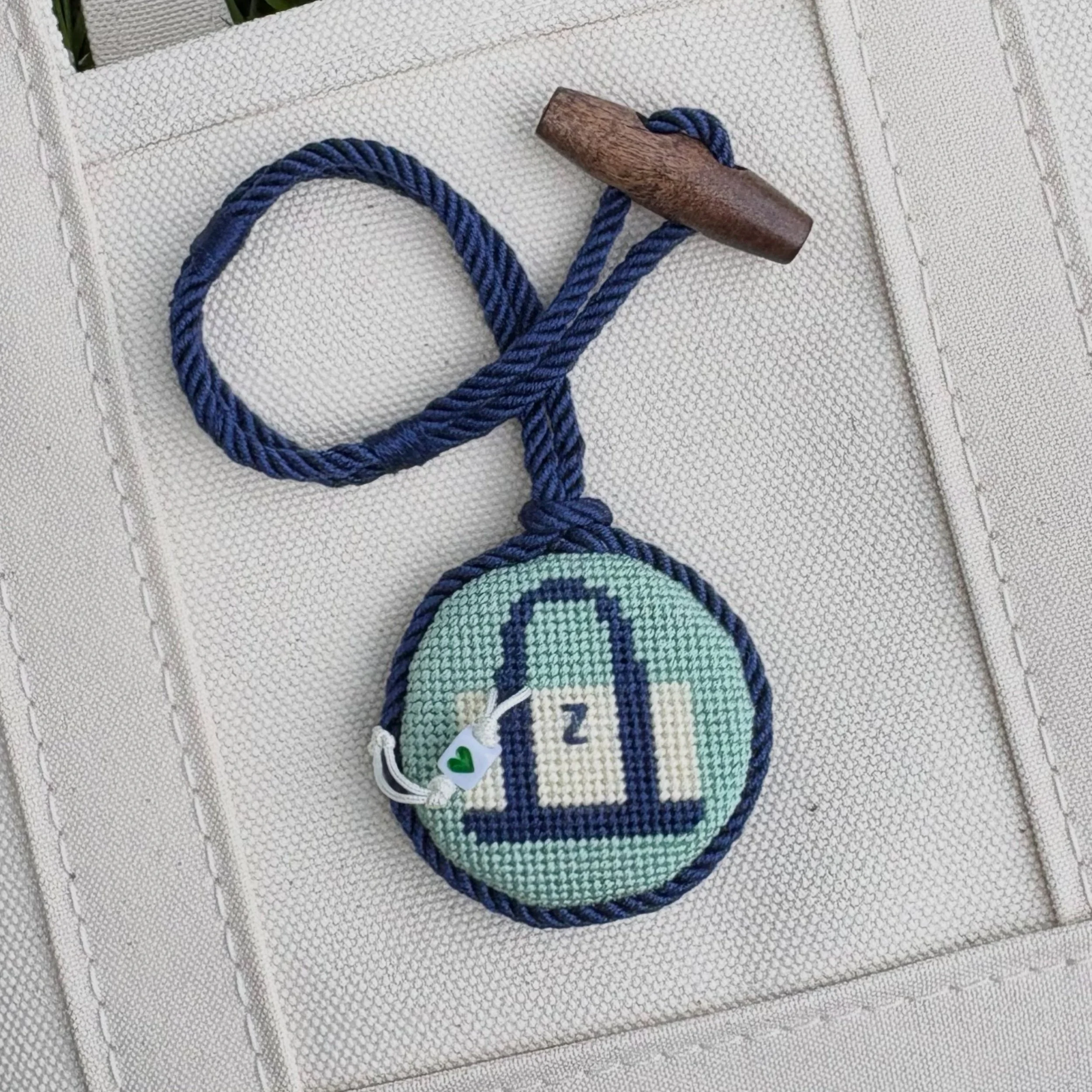 Boat and tote with a boat and tote charm with its own charm and the tiniest monogram. Toteception. The wooden toggle is a new addition that I am VERY excited about! You can get the tote chart and book finishing services in my shop. Want to add a fun 