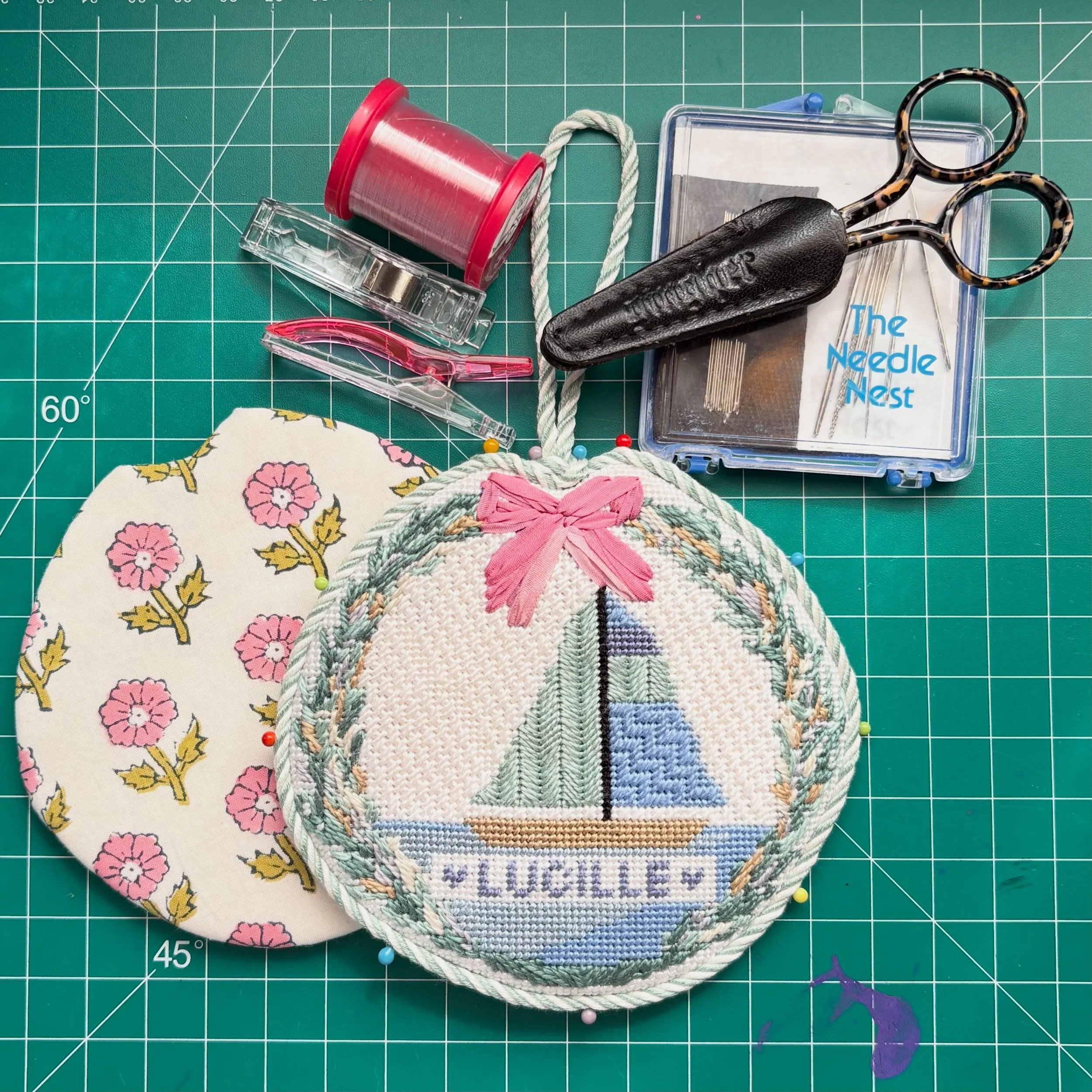 Now that it&rsquo;s been gifted I can share this sweet sailboat stitched by @veronicaplna - the gorgeous garland and ribbon work bow make it so special. Designer is tagged! #needlepointfinishing #needlepointfinisher #ndplt