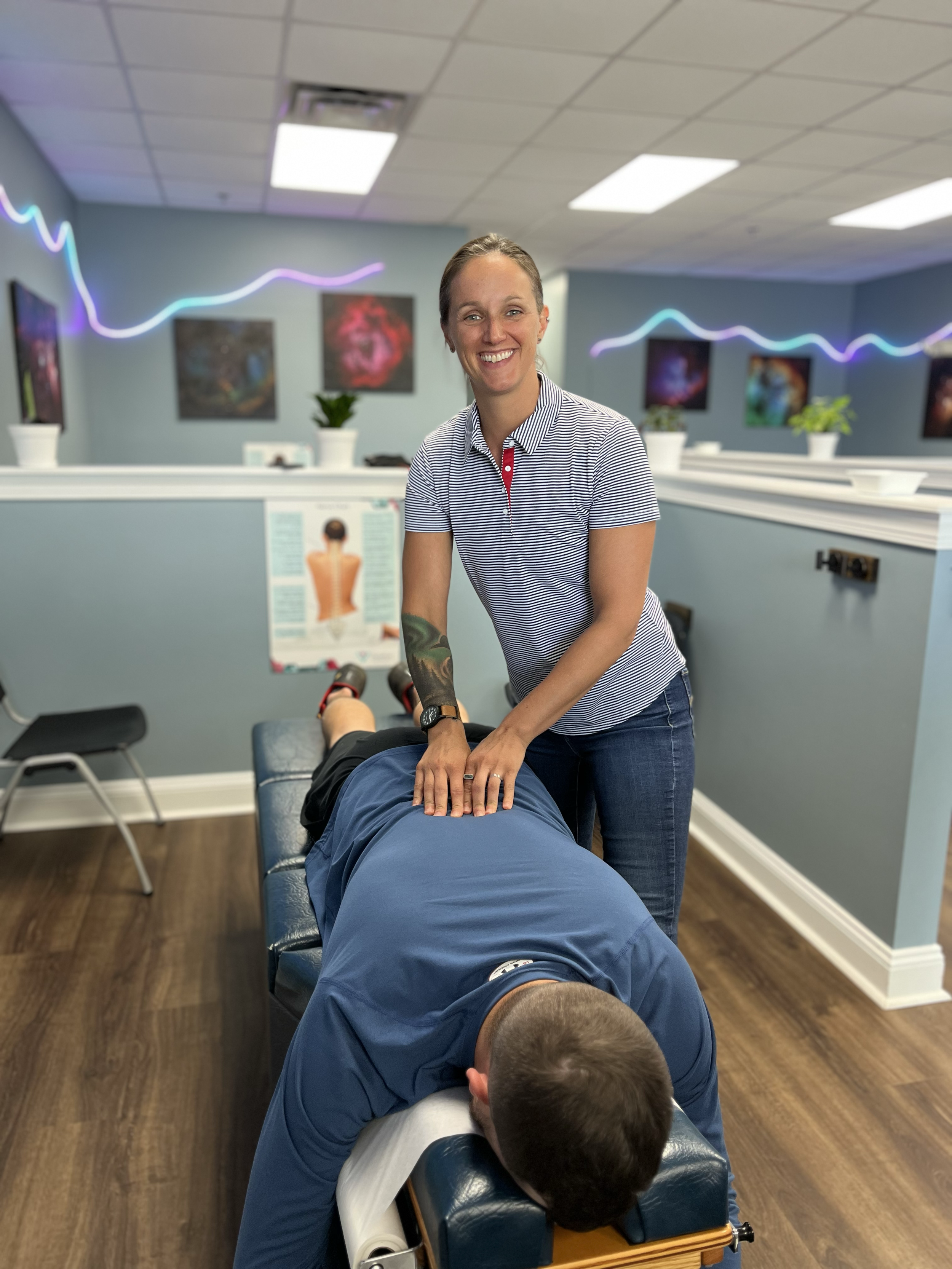 Dr. Jen giving a chiropractic adjustment at ChiroPure in Concord.