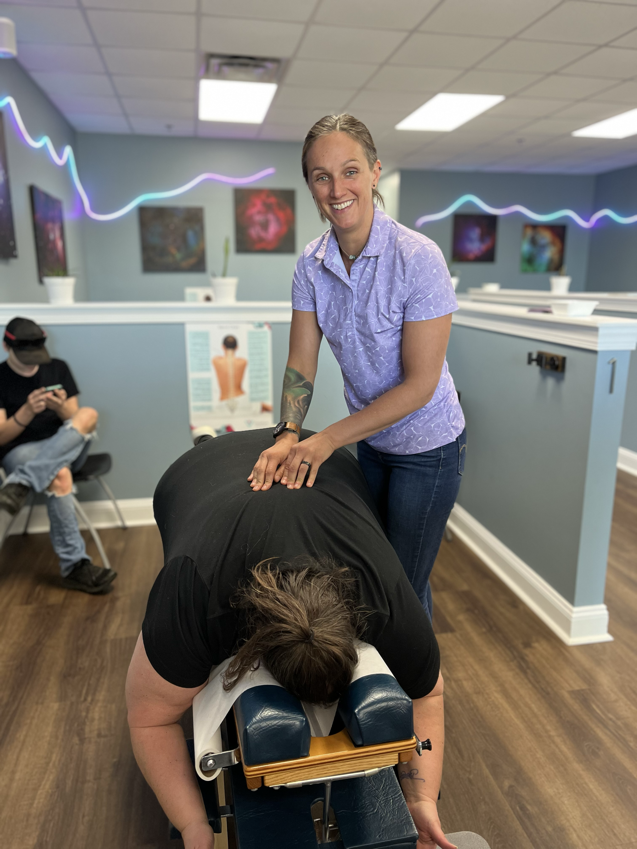 Dr. Jen giving a chiropractic adjustment at ChiroPure in Concord.