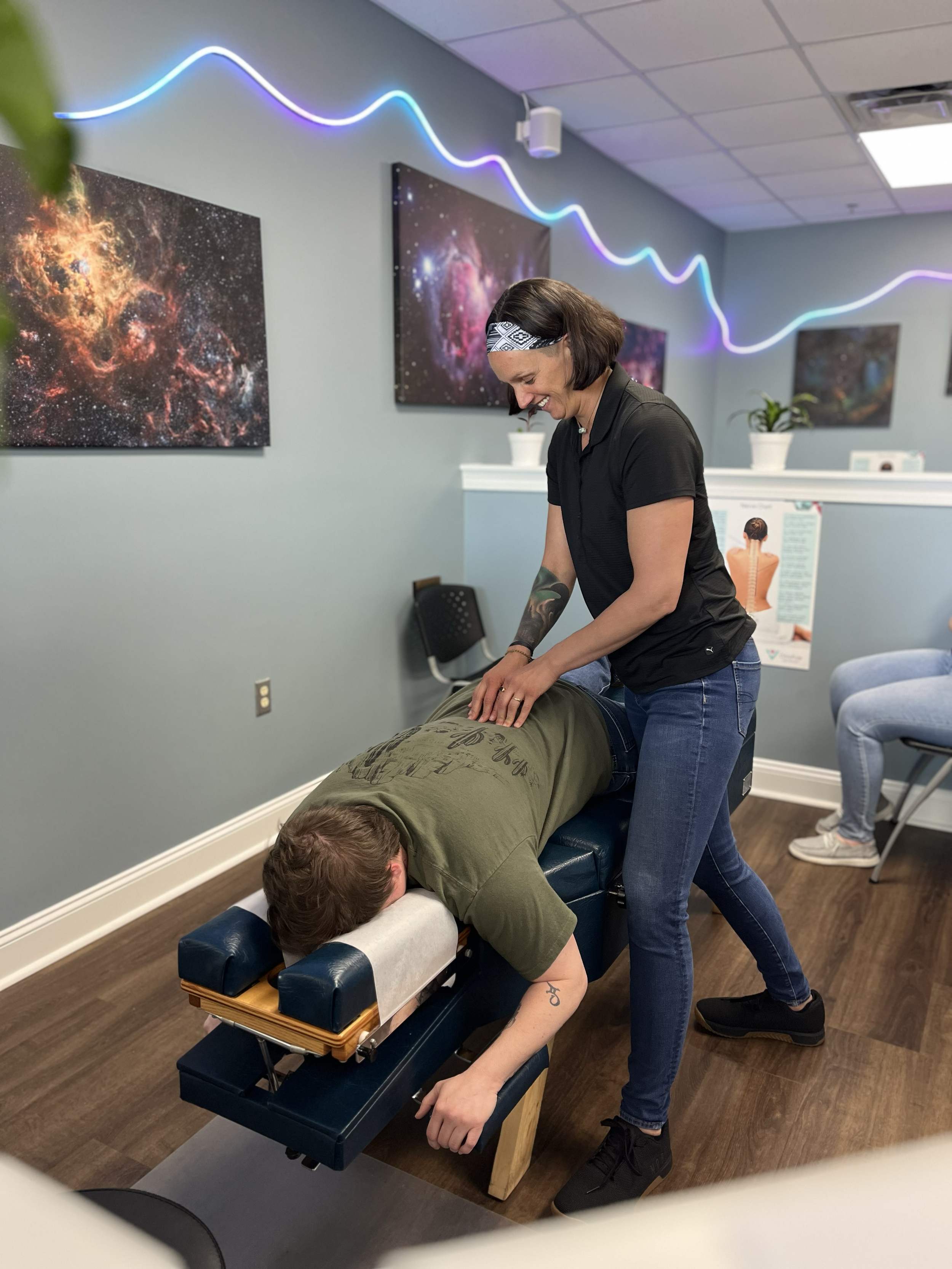 Dr. Jen giving a chiropractic adjustment at ChiroPure in Concord.