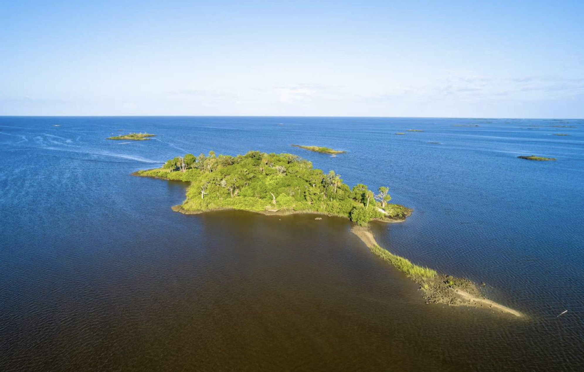 Sundown Republic Island in the Gulf of Mexico with green trees