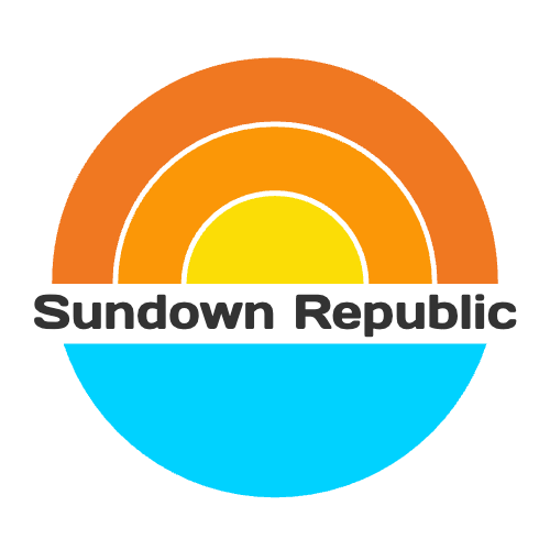 Sundown Republic logo: A yellow sun with orange rays setting above the horizon of bright blue water.