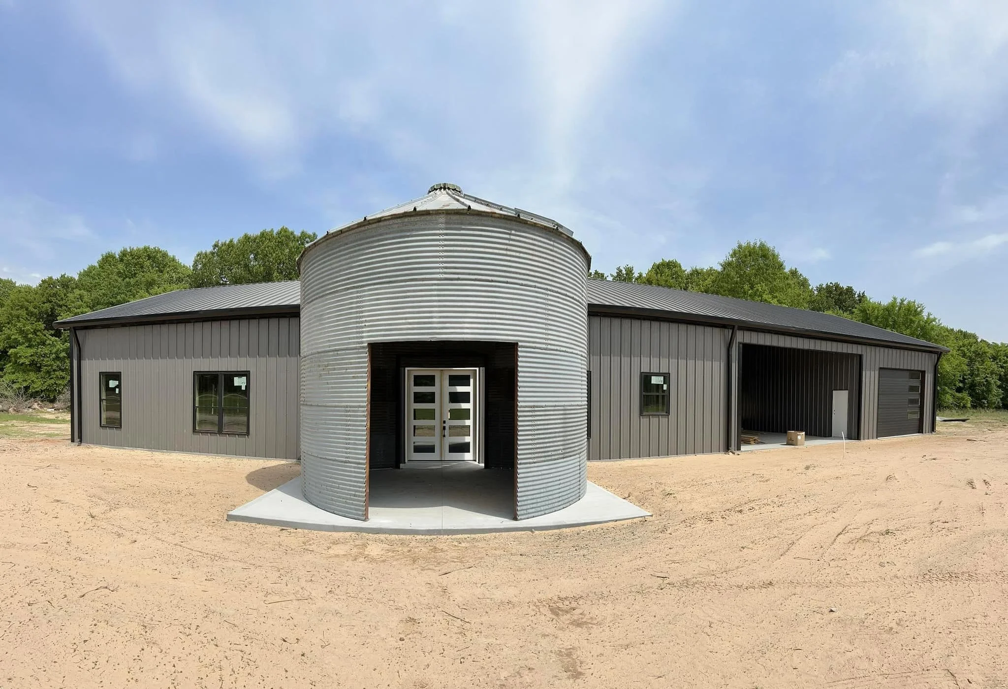 Gray steel building with special stock tank entryway