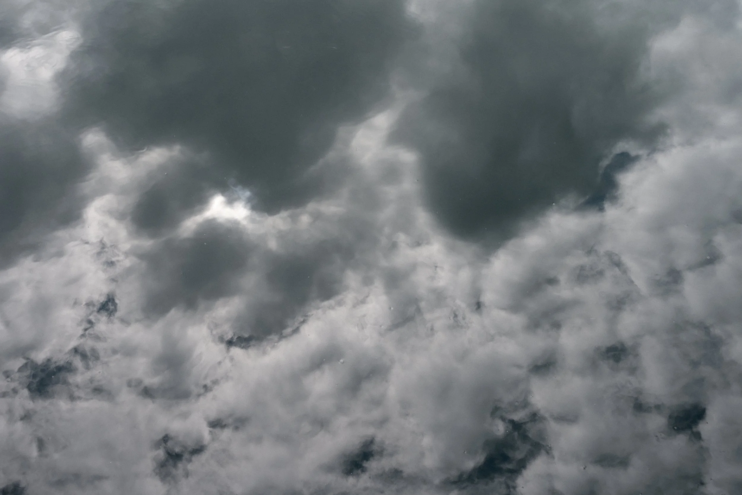 Sky filled with dark, gray storm clouds.