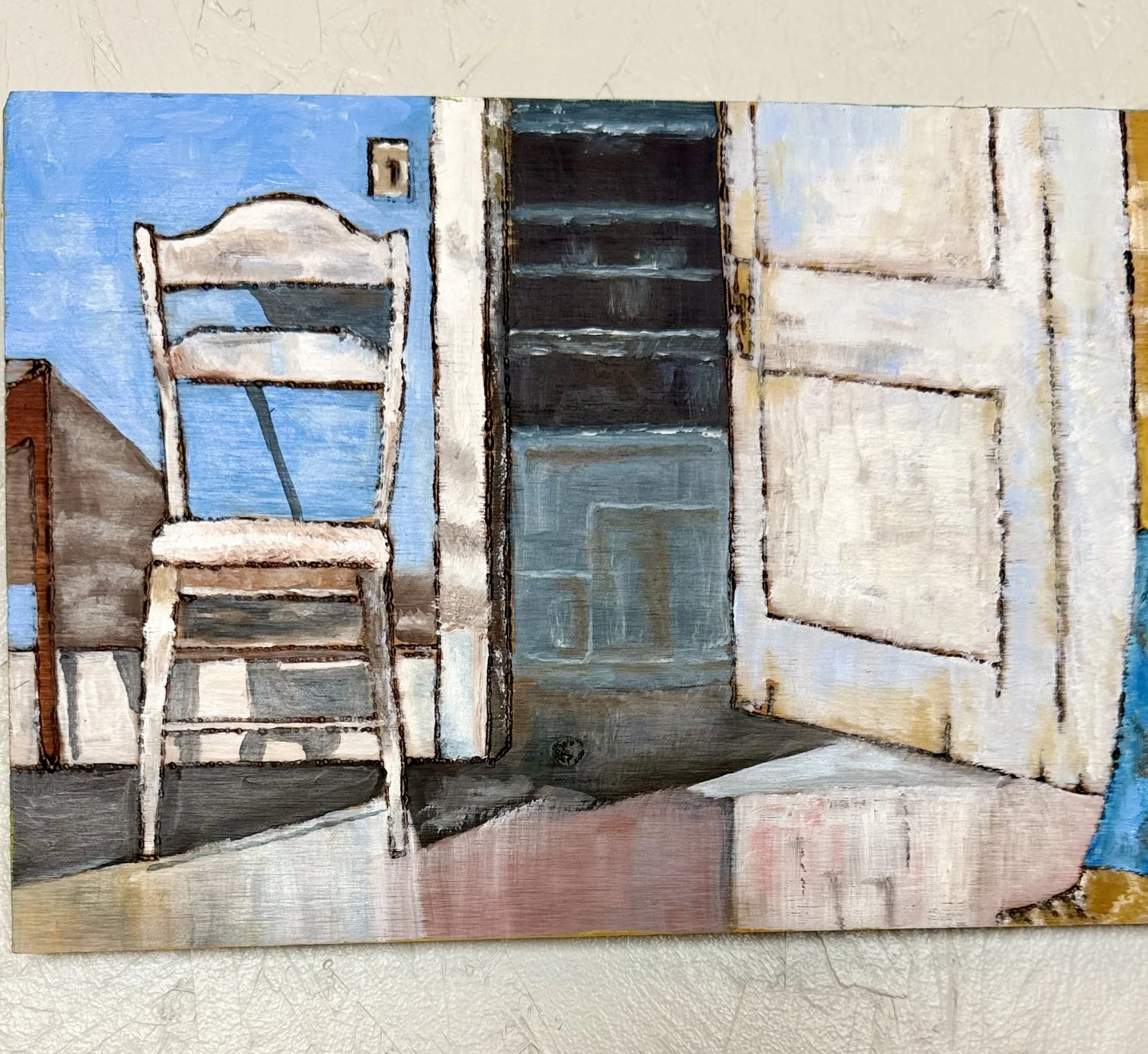 Close-up detail of original painting on wood showing empty white chair, open door, cool blue tones, burned line work in pine, one of a kind wall art by Leslie Wisenbaker