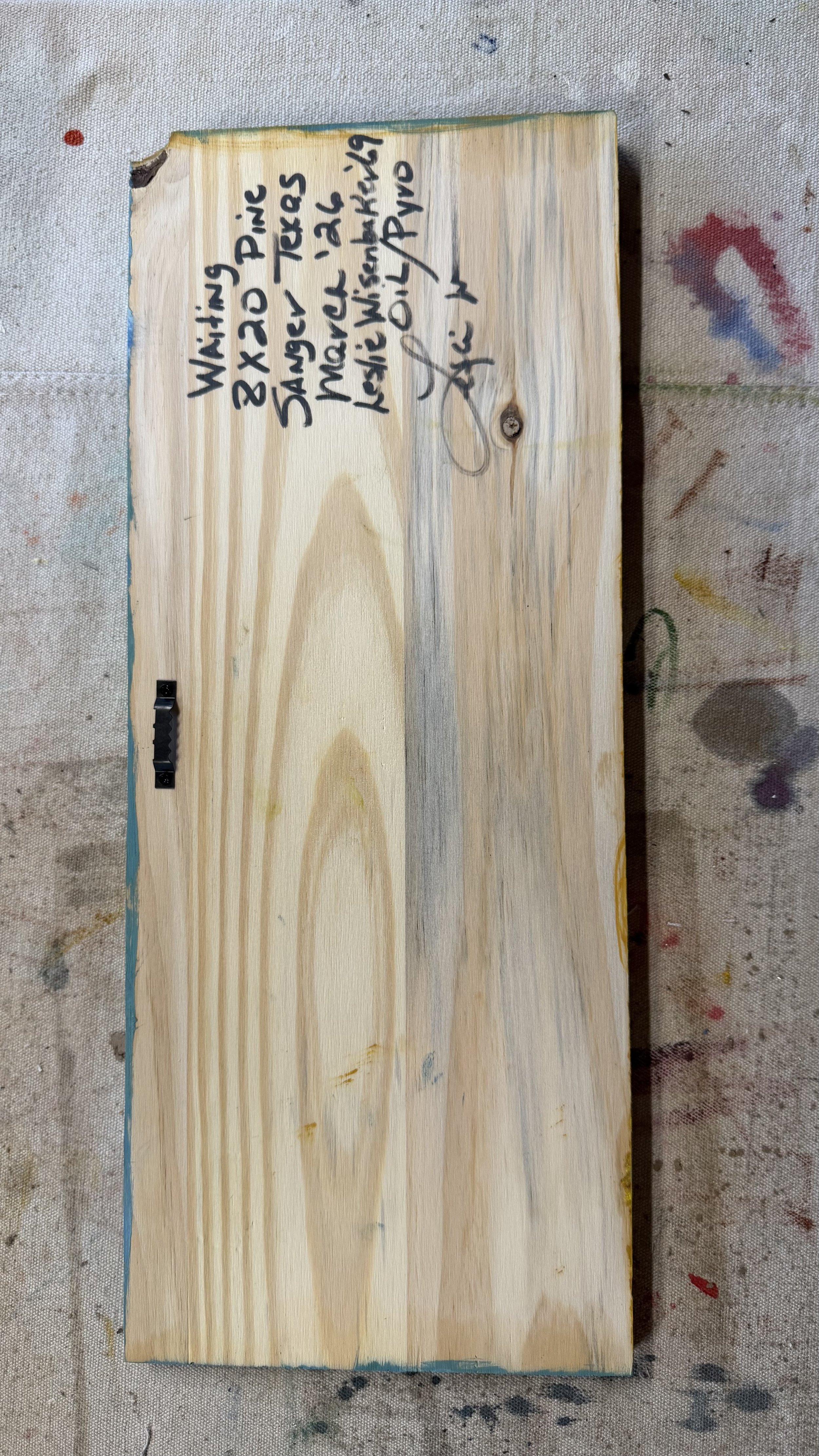 Back of original pine board painting showing artist inscription, title Waiting, medium oil and pyrography, signed by Leslie Wisenbaker, Sanger Texas 2026