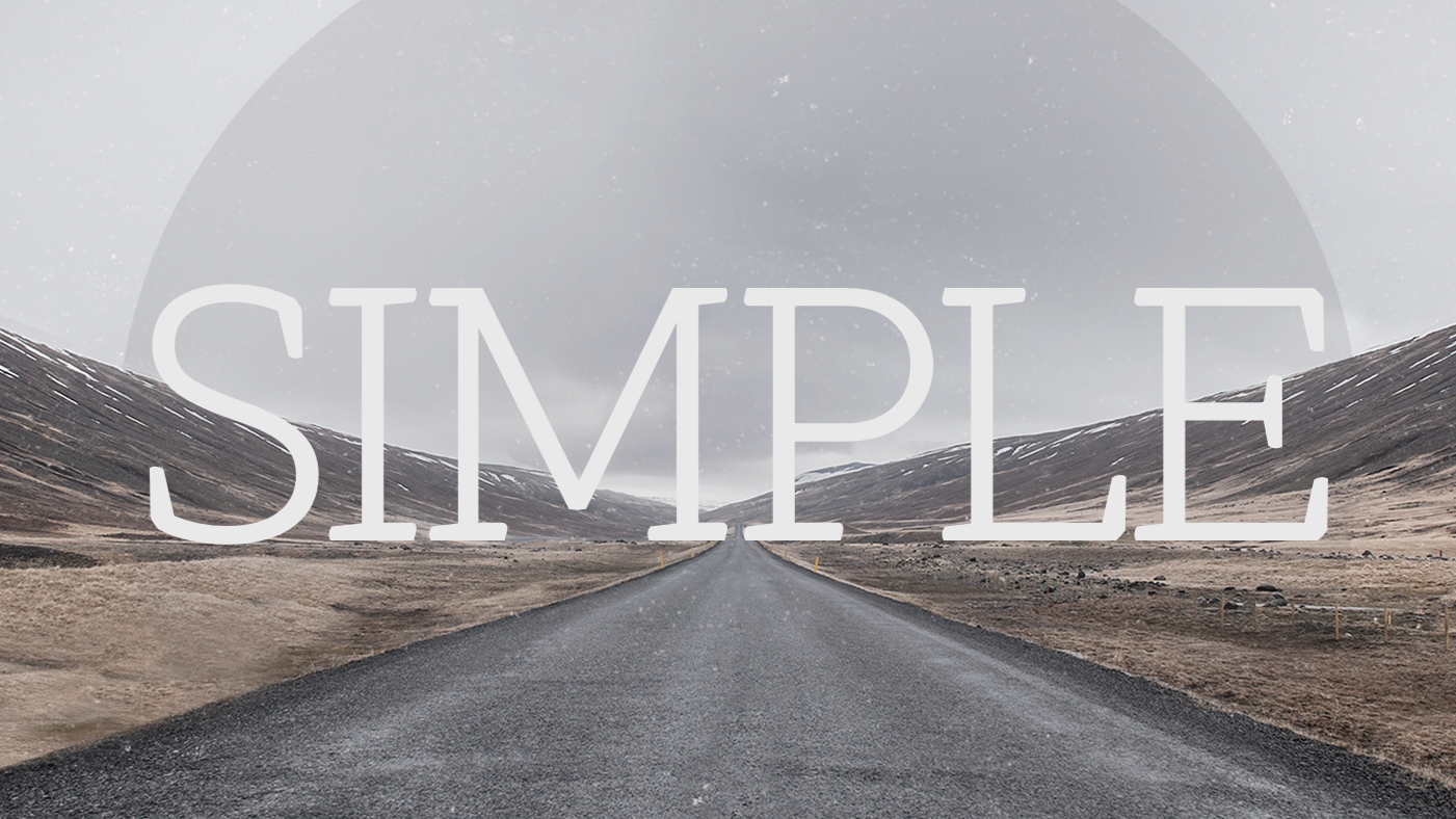 A straight empty road leading to distant mountains under a cloudy sky with the word 'SIMPLE' overlayed in large white letters.