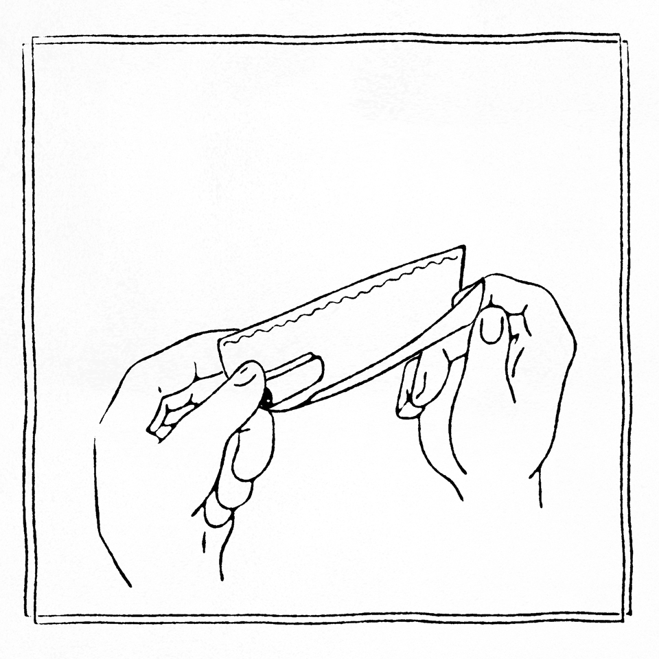 A pair of hands holding a razor blade, with the thumb and index finger gripping the handle and the other fingers supporting the blade.
