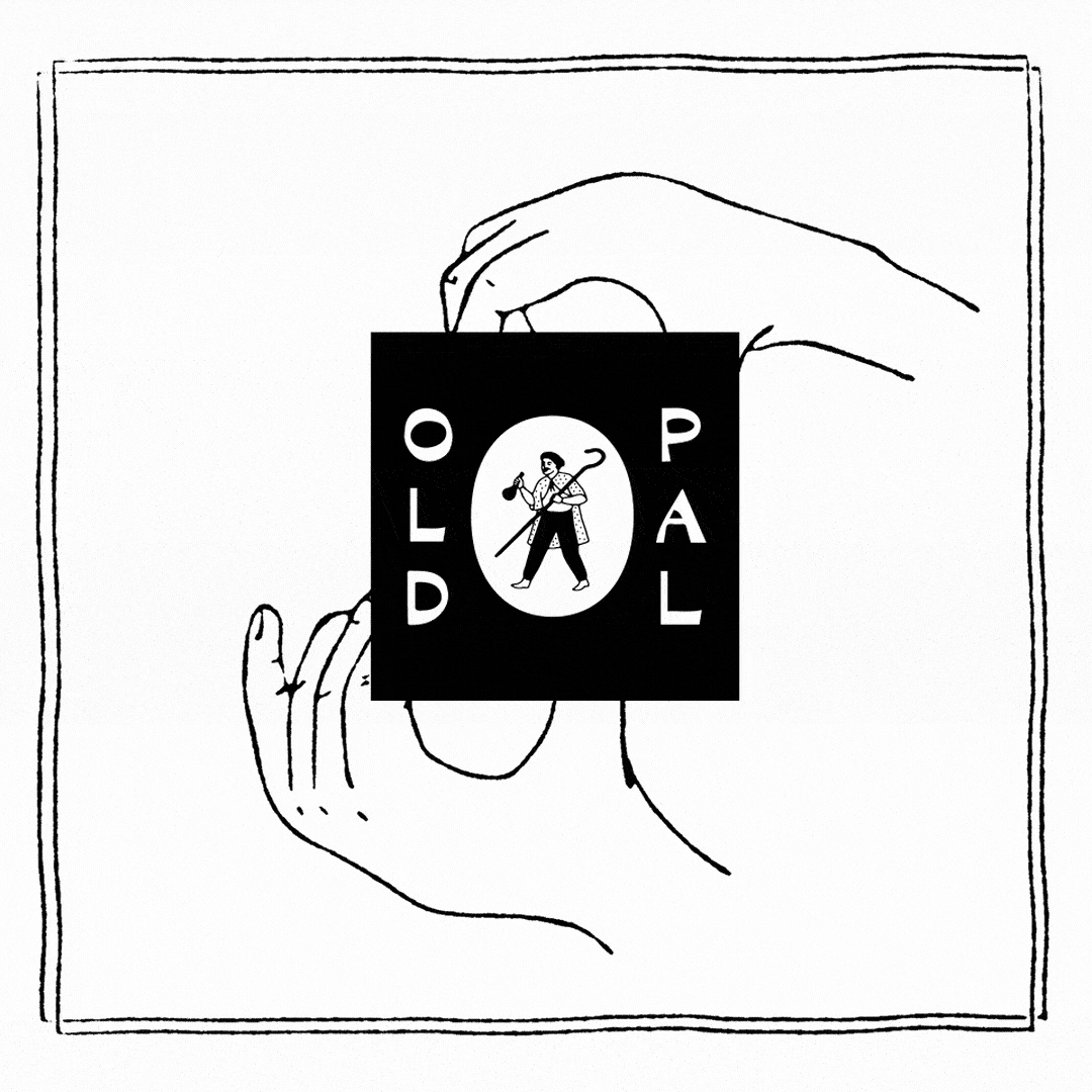 A line drawing of two hands holding a booklet titled "OLD PAL" with an illustration of a person playing golf on the cover.