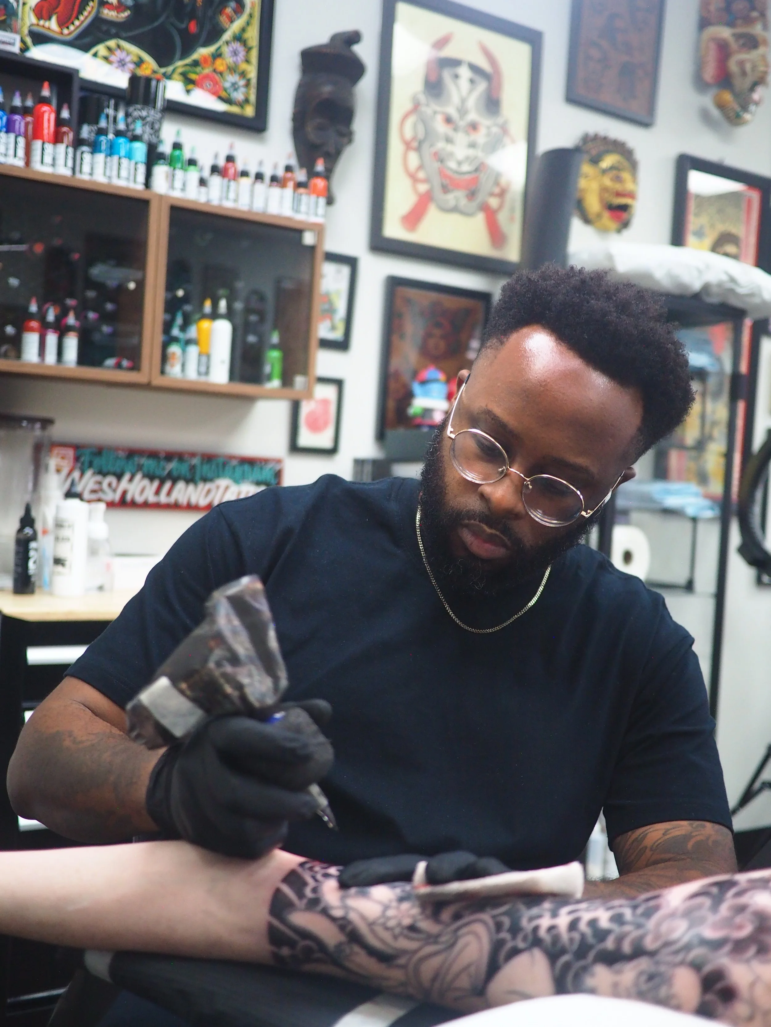 Atlanta tattoo artist Wes Holland Working on a tattoo sleeve at Lightwork Tattoo in Atlanta