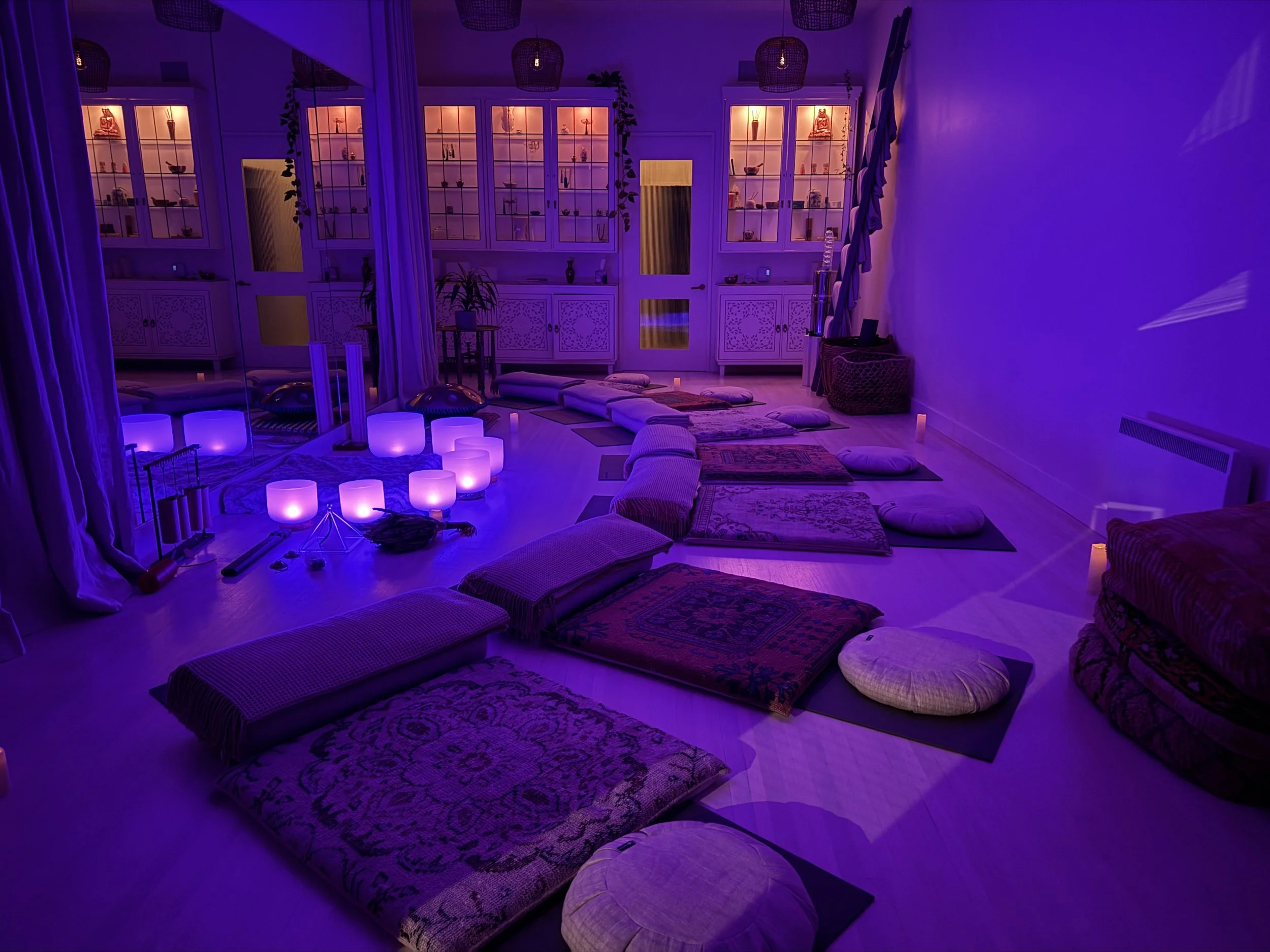Private sound bath setup for a special event in Vancouver with crystal singing bowls, handpan, chimes, candles, mats, blankets, and calming decor by Solar Soul Circle.