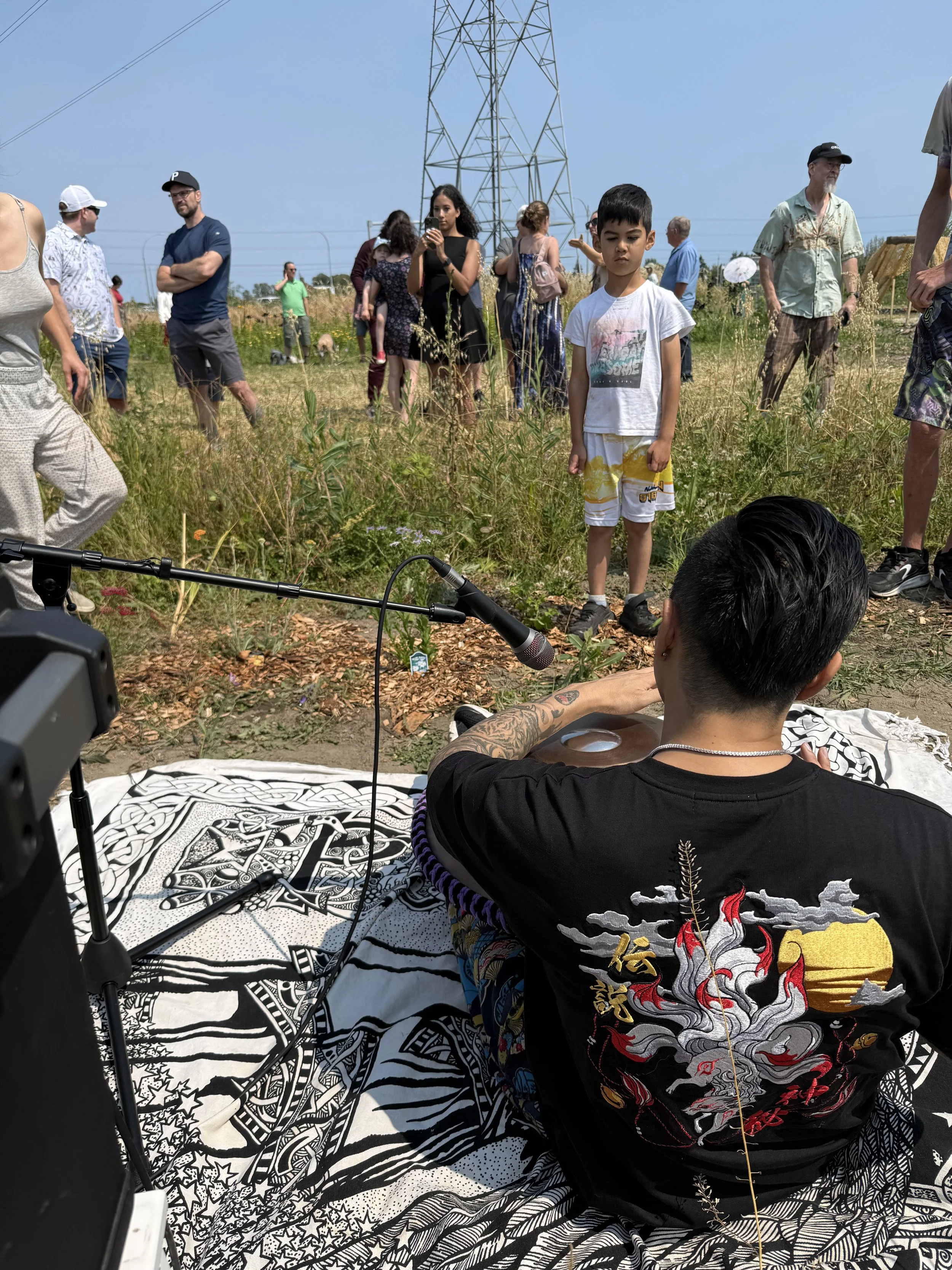 A POV view of Alex playing the handpan at the grand opening of Petal Paradise in Tsawwassen