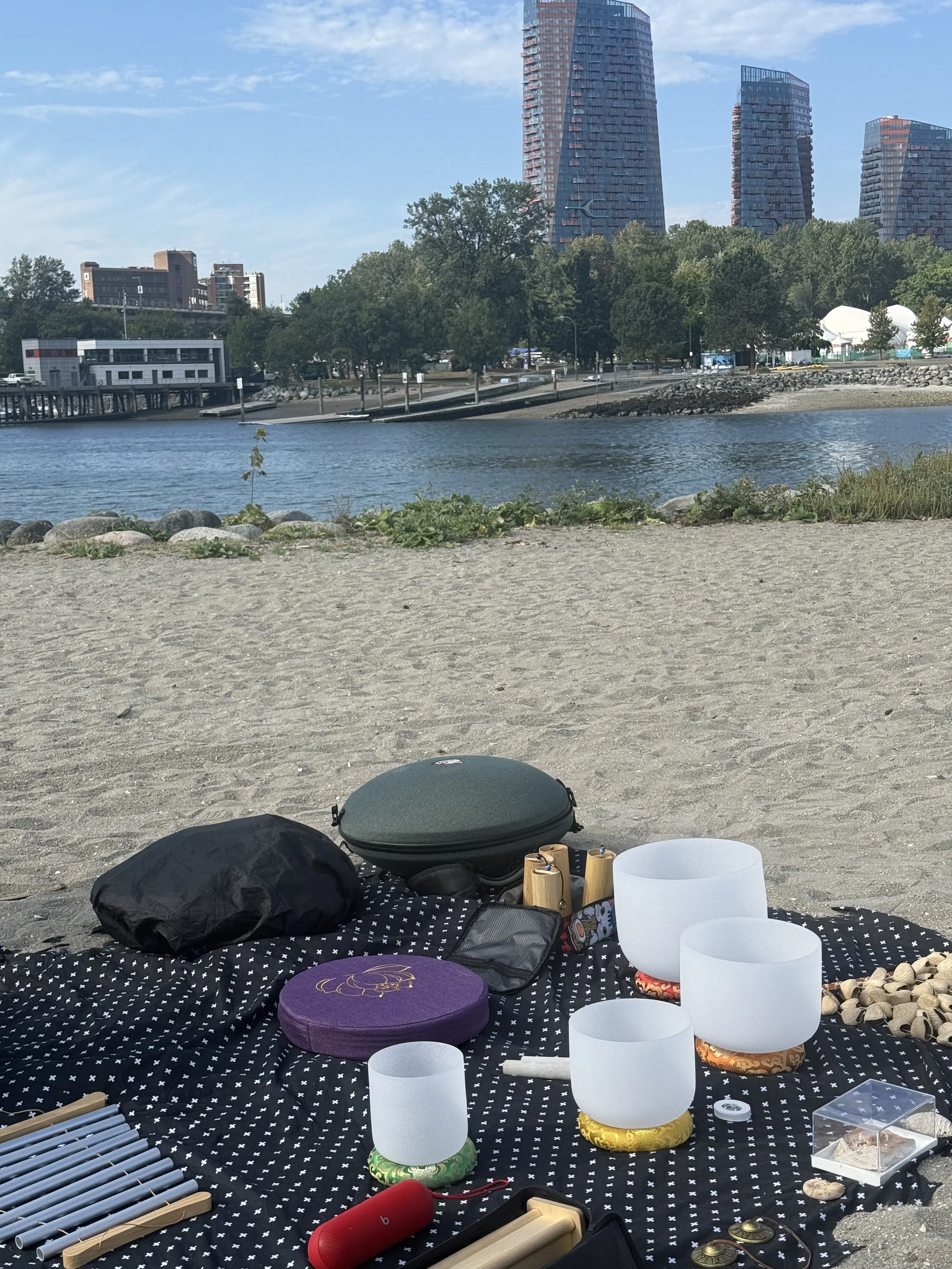 Sound healing instruments laid out for beach sound bath