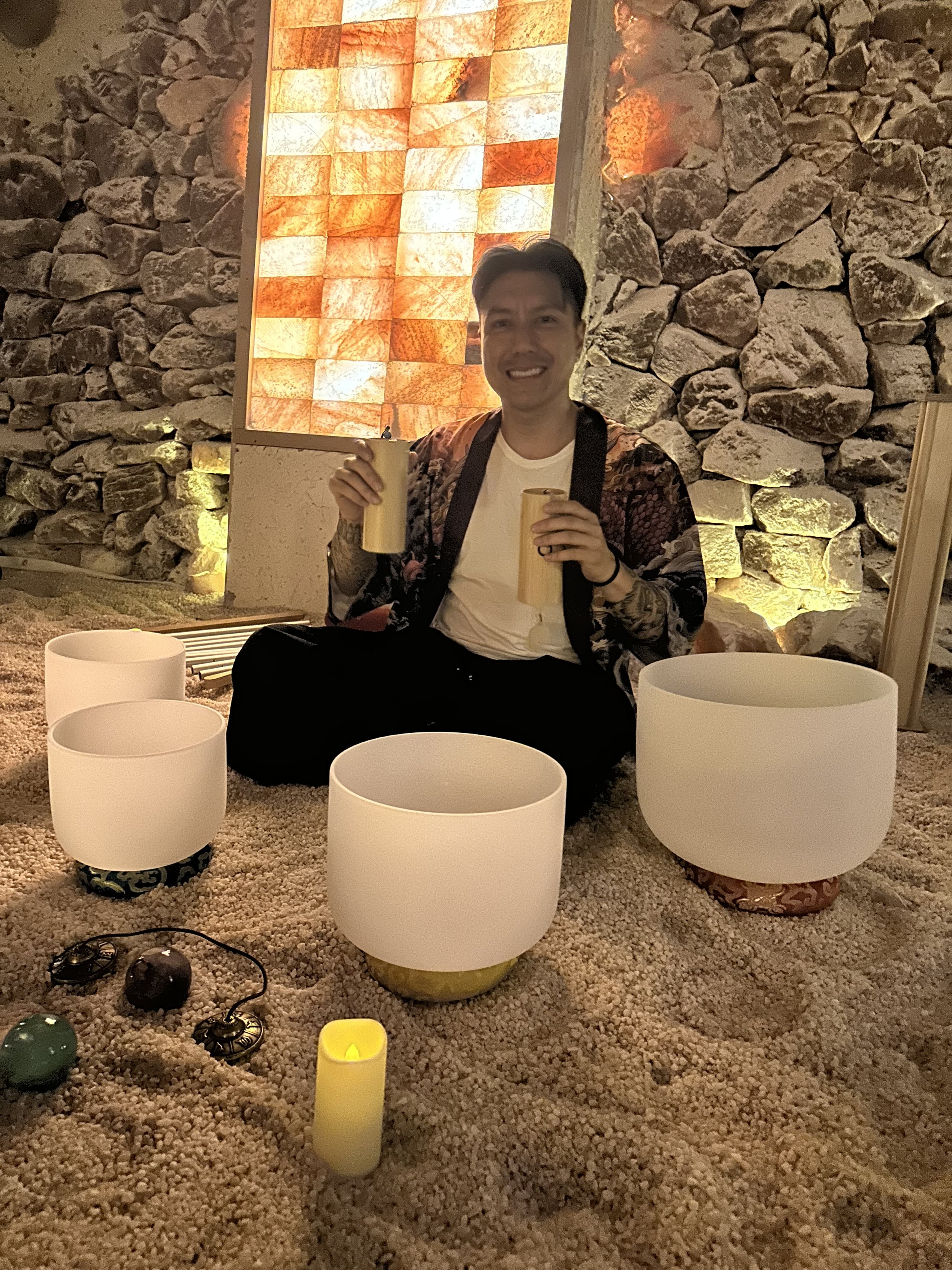 Alex Ma from Solar Soul Circle holding chimes for a sound bath at the Saltwonder Himalayan Salt Cave in North Vancouver
