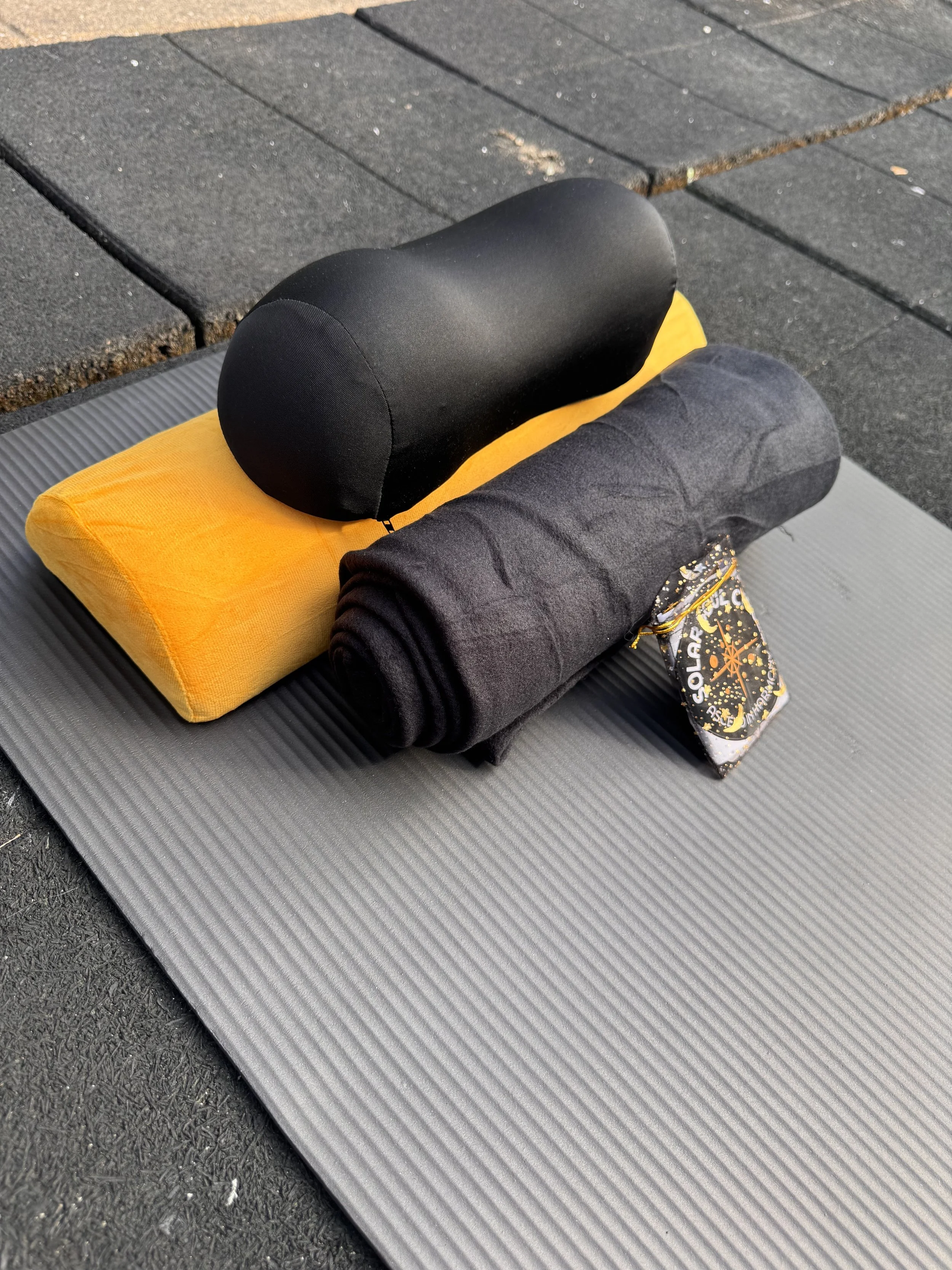 Corporate sound bath rental setup of yoga mat, bolster, blanket, and pillow for employees of companies who would like everything included in their events.