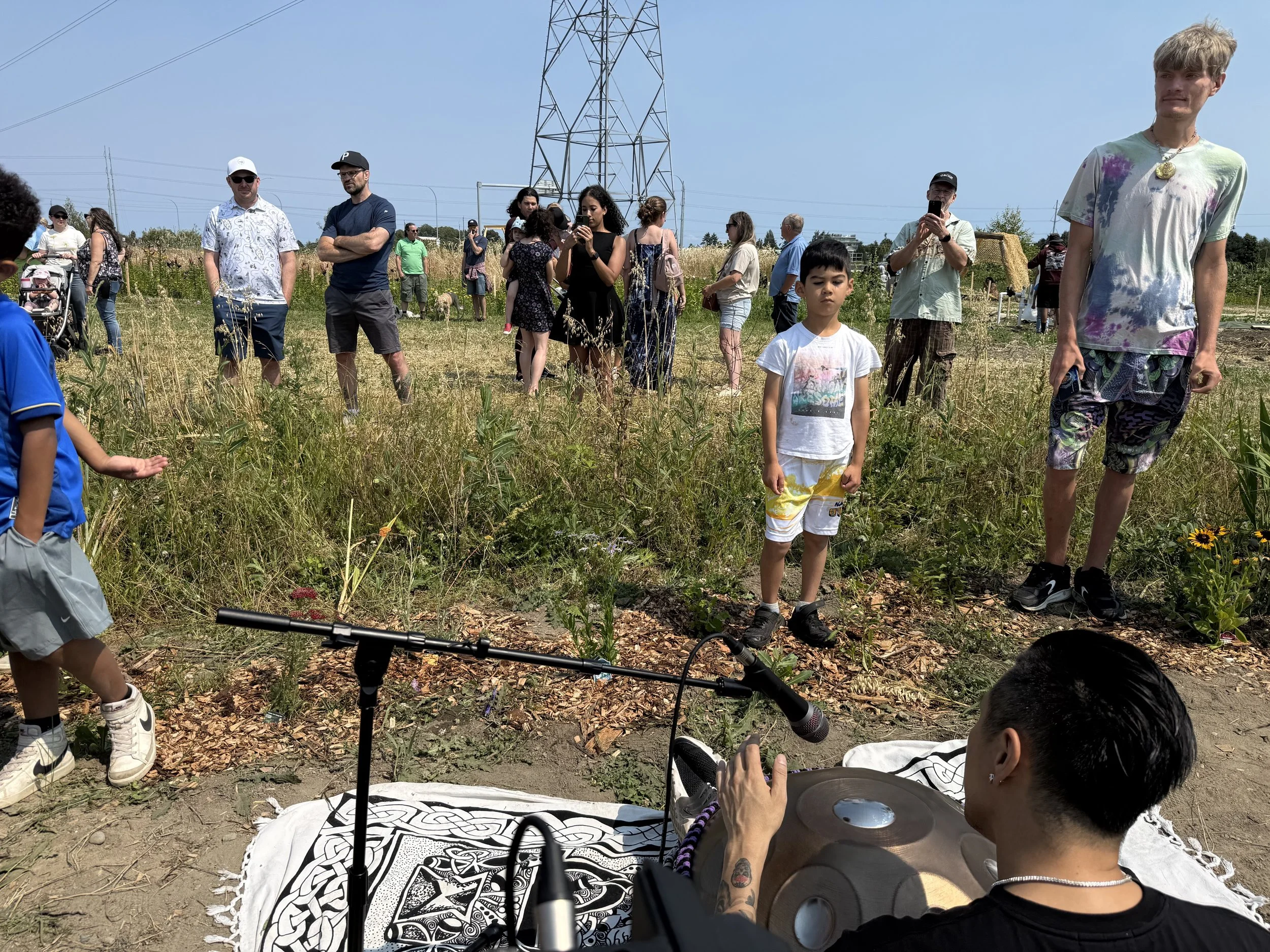 A POV of Alex from Solar Soul Circle playing the handpan for the children and friends of Petal Paradise