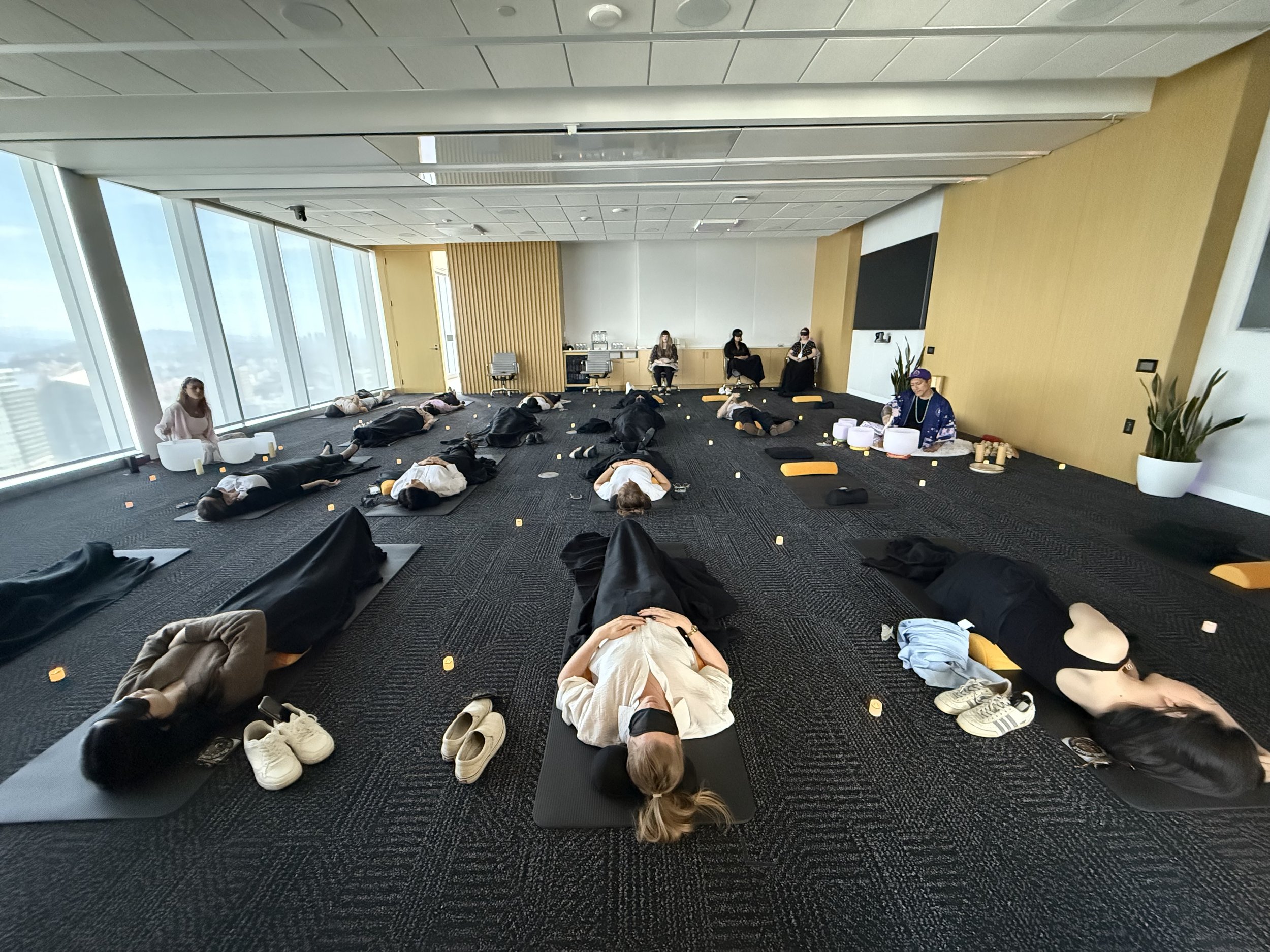 A private group sound healing session in Vancouver with Solar Soul Circle using crystal singing bowls with guests meditating