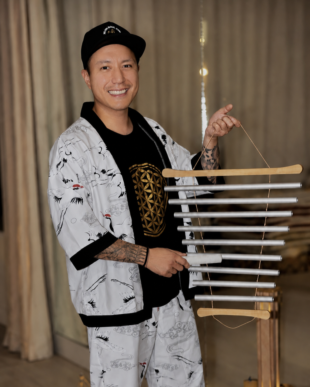 Alex Ma of Solar Soul Circle preparing a private sound bath for a special event in Vancouver with chimes, and calming instruments.