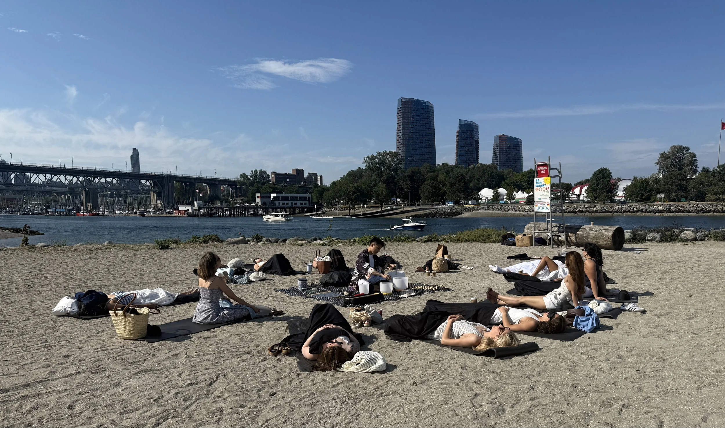 Solar Soul Circle facilitating a sound bath at third beach in Vancouver for a corporate wellness event