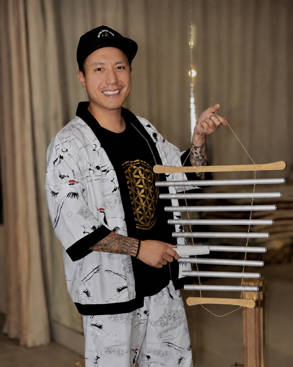 Alex Ma of Solar Soul Circle facilitating a sound bath in Vancouver with chimes.