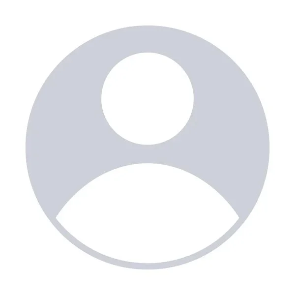 Generic user profile icon with a circular gray background and a simplified white silhouette of a person.