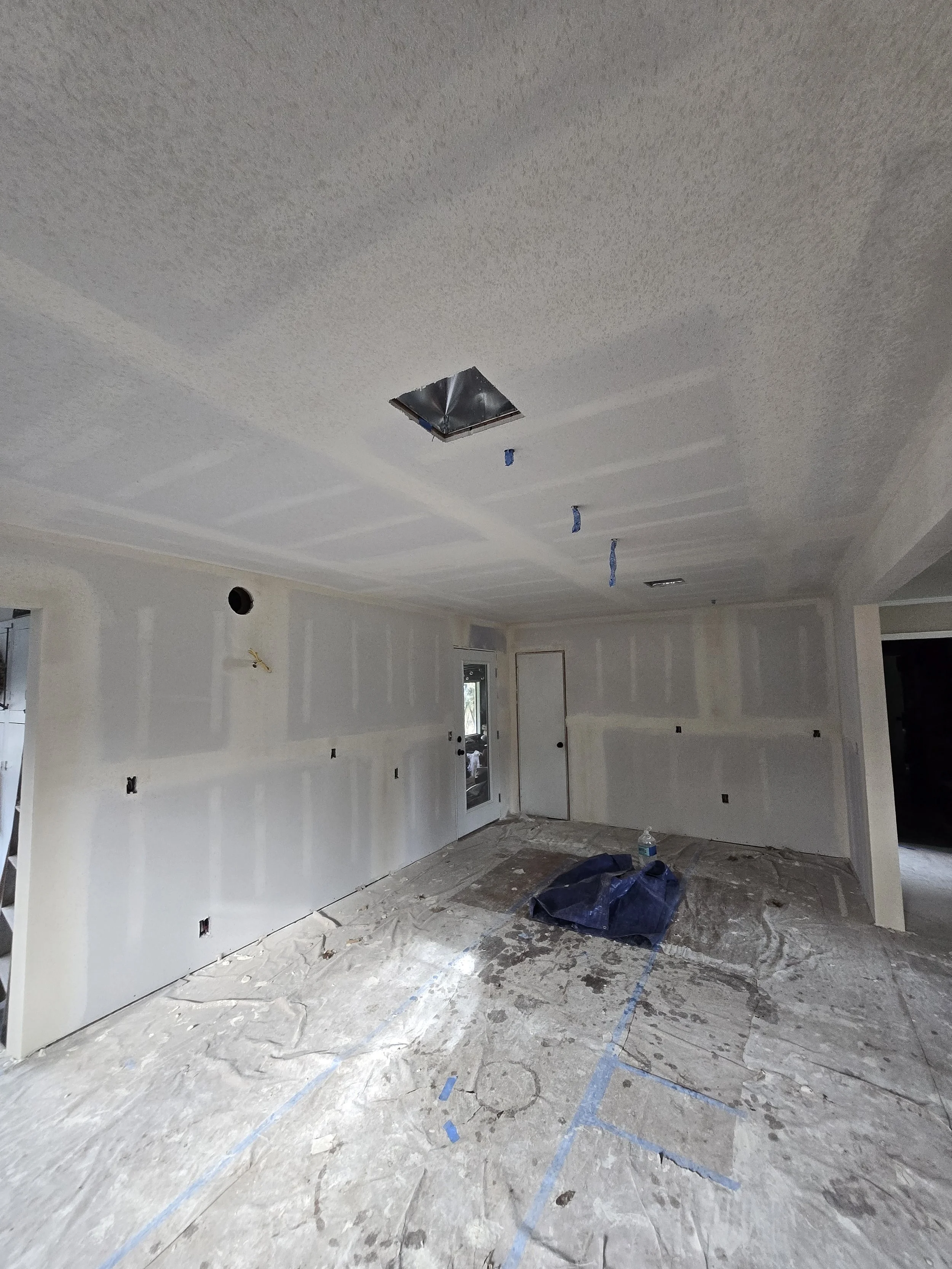 Finished kitchen drywall with clean lines and a light orange peel texture, completed as part of a remodel in Junction City, Oregon.