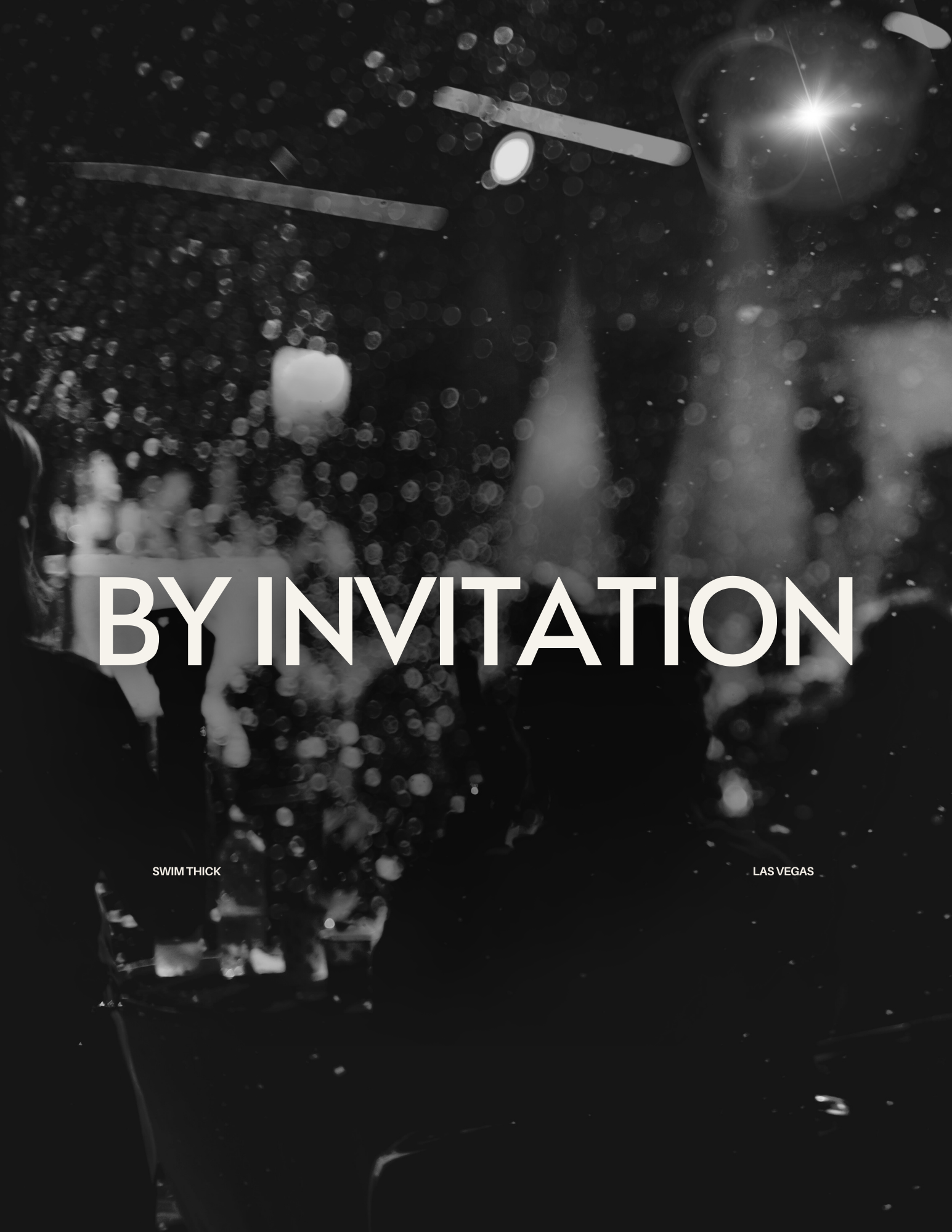 Black and white photo of a city at night with blurred lights and people, overlayed with the text 'BY INVITATION'.