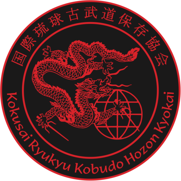 A crest with a dragon representing an Okinawan ryukyu kobudo weapons association.