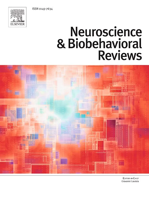 Cover of a scientific journal titled "Neuroscience & Biobehavioral Reviews" with a colorful digital abstract background.