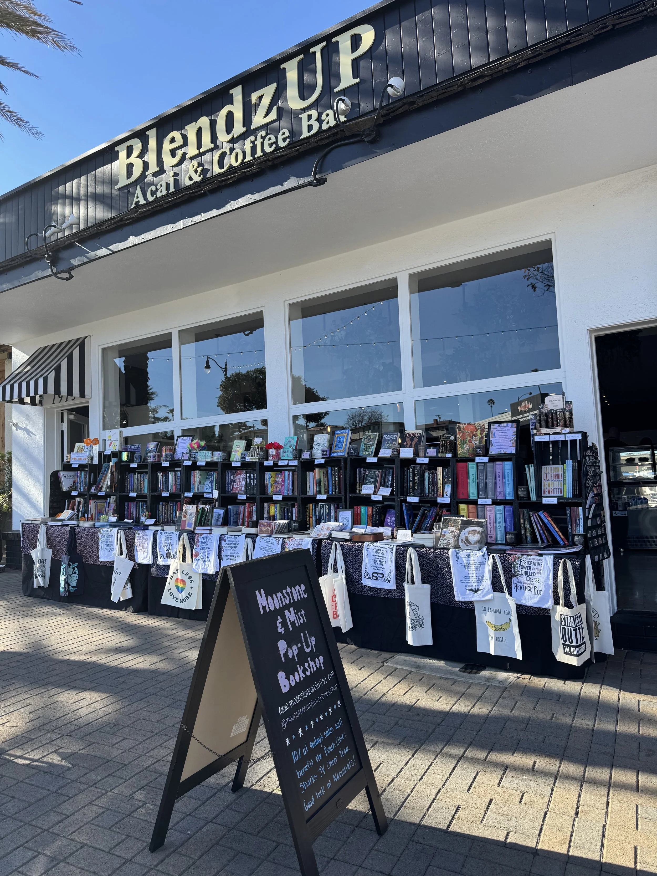 Moonstone & Mist Bookshop pop-up setup at BlendzUP Acai & Coffee Bar in Redondo Beach, Ca