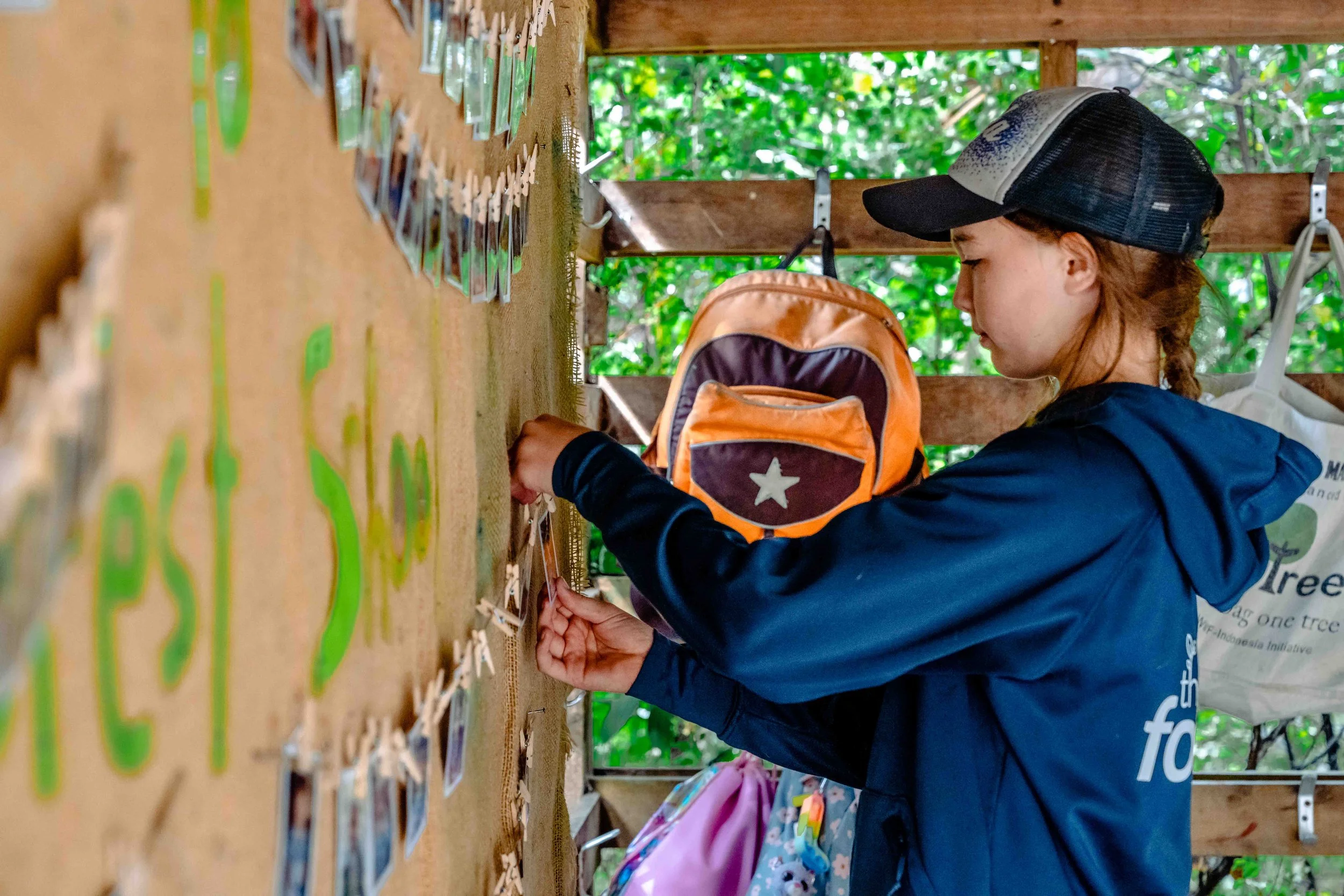 Child participating in routine at the forest school