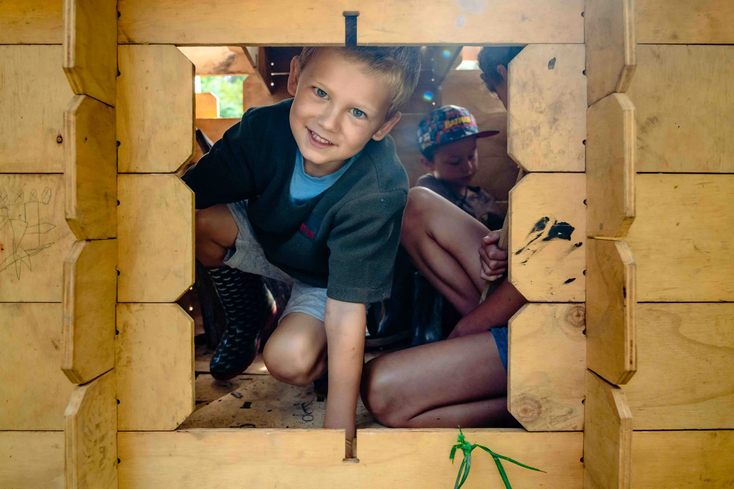 The Forest School student building a cubby