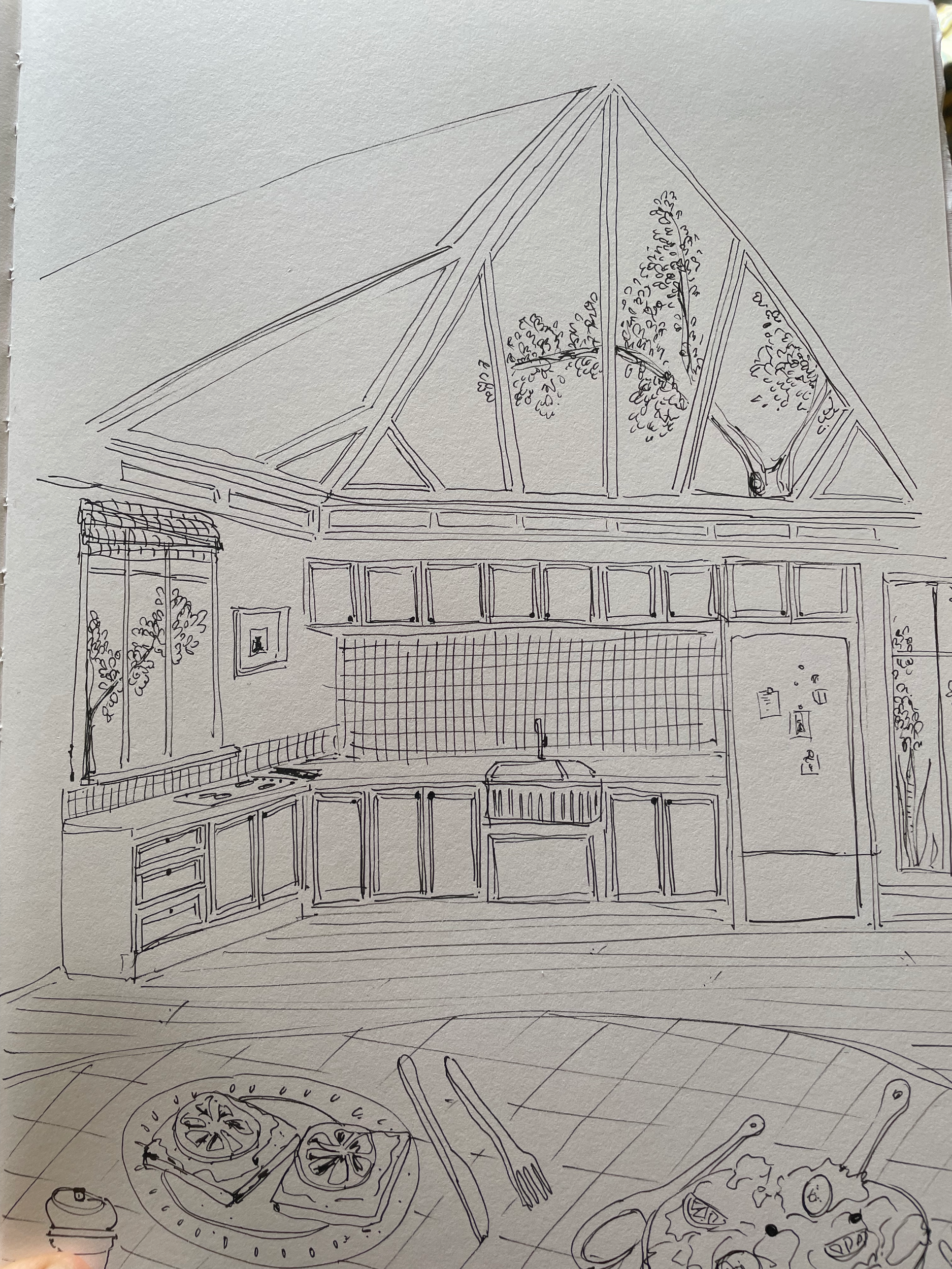 A line drawing of a kitchen with a skylight ceiling and hanging trees visible through the glass. The kitchen has upper and lower cabinets, a tiled backsplash, a sink, and a refrigerator. On the table in the foreground, there are two plates of food, u