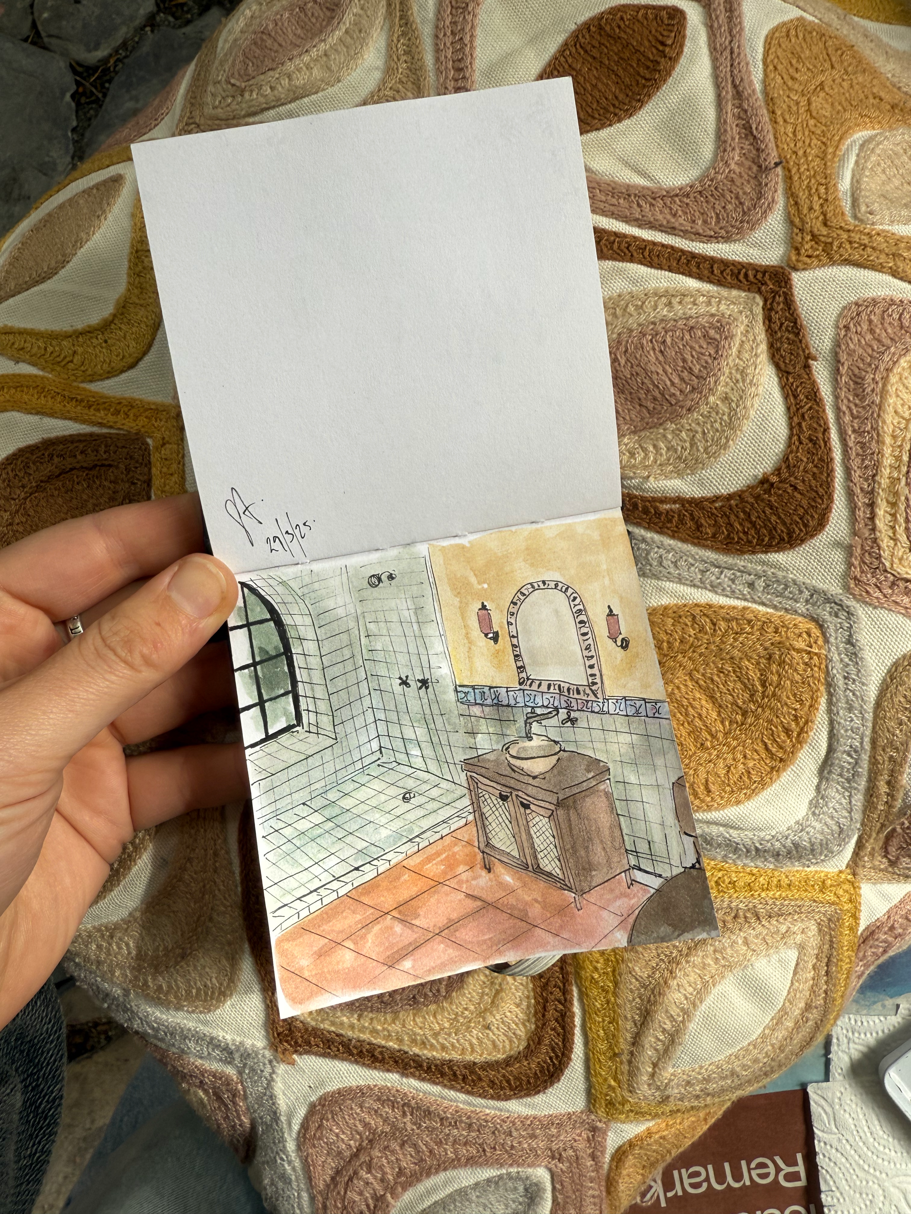 A watercolor illustration of a bathroom, showing a sink, a mirror, a shower with a window, and tiled walls.