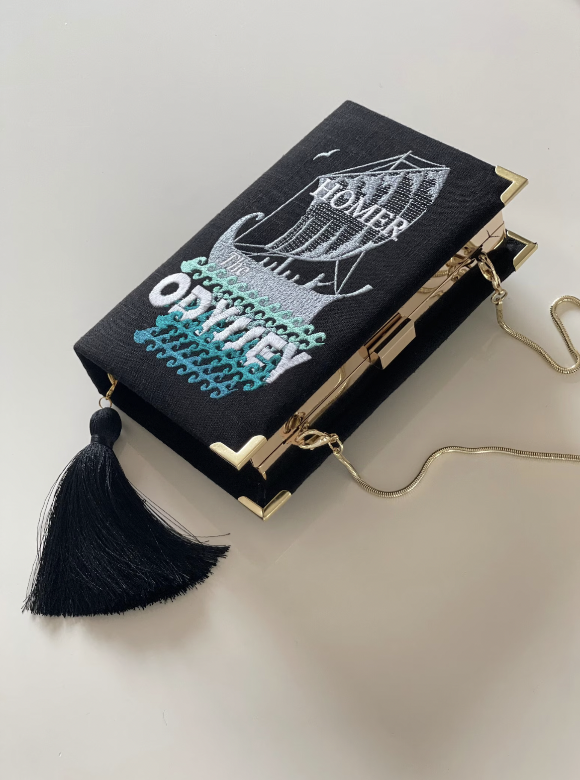 VRStorybook (via Etsy) Homer's the Odyssey Book Clutch