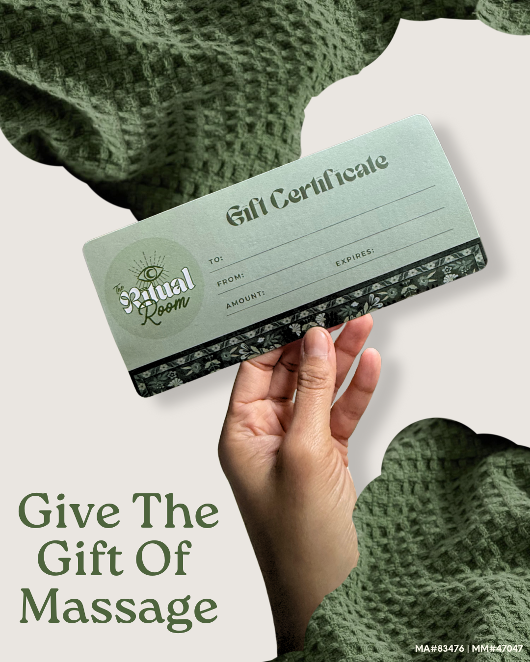 Close-up of a hand holding a gift certificate for The Ritual Room, with text encouraging giving massages as gifts, against a background of green textured fabric.