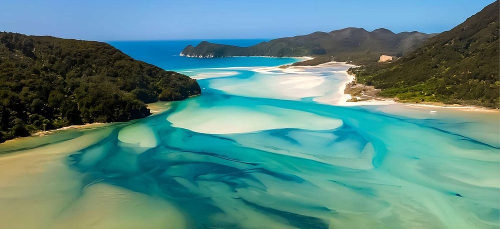Turquoise tidal channels and golden sand in Abel Tasman National Park