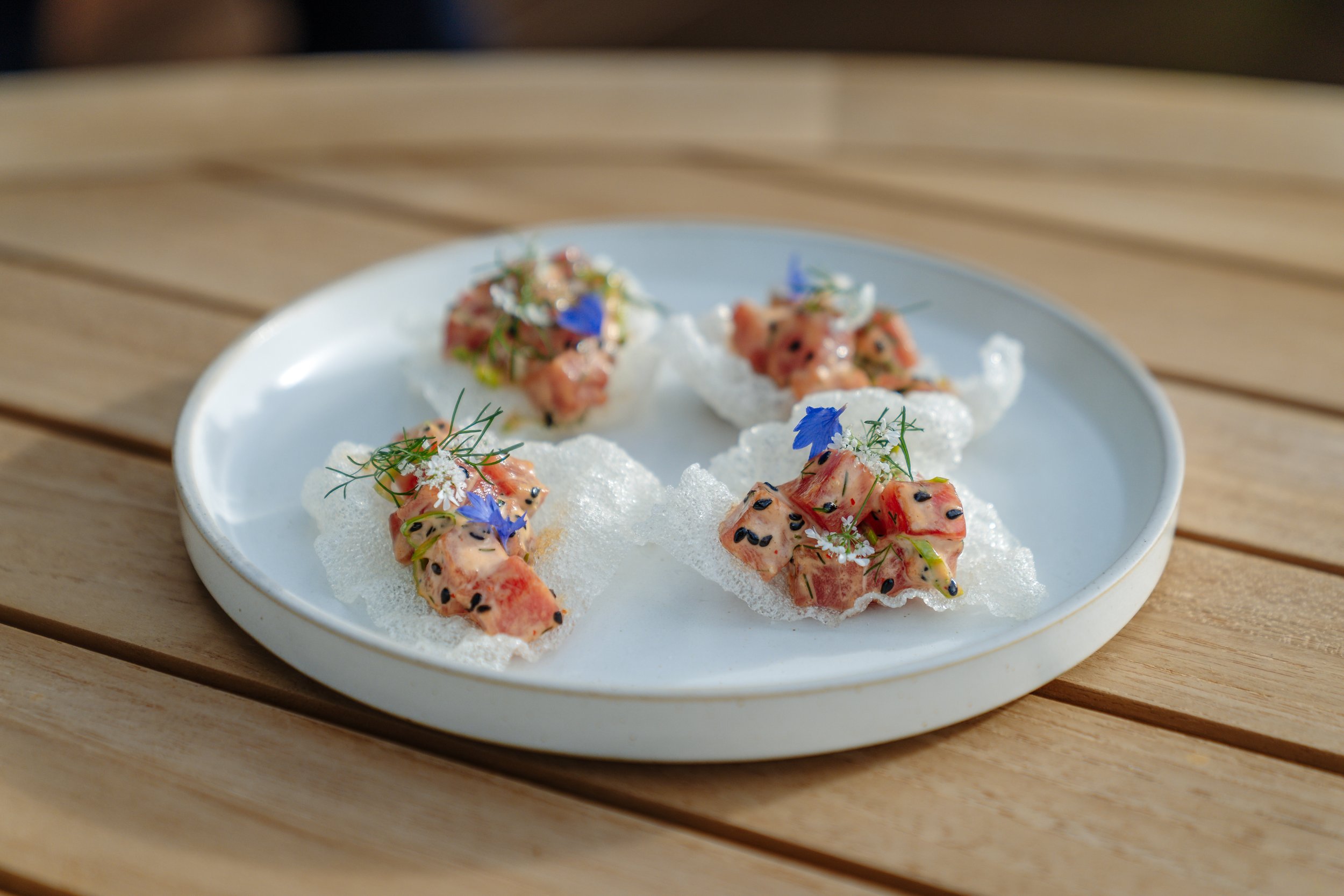 Spicy yellowfin tartare on rice paper at Stonefly Lodge