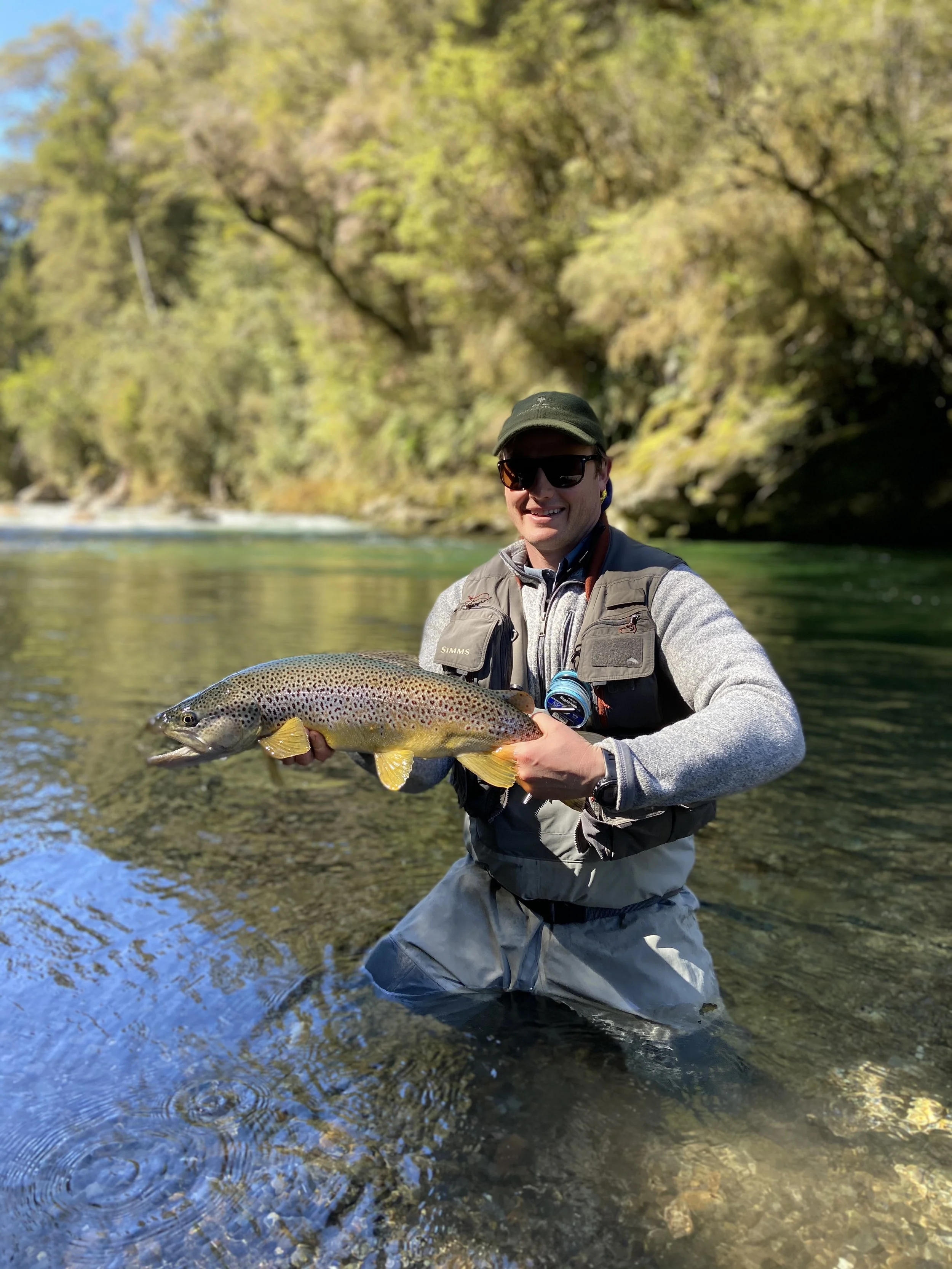 Guest with trophy brown trout near Stonefly Lodge
