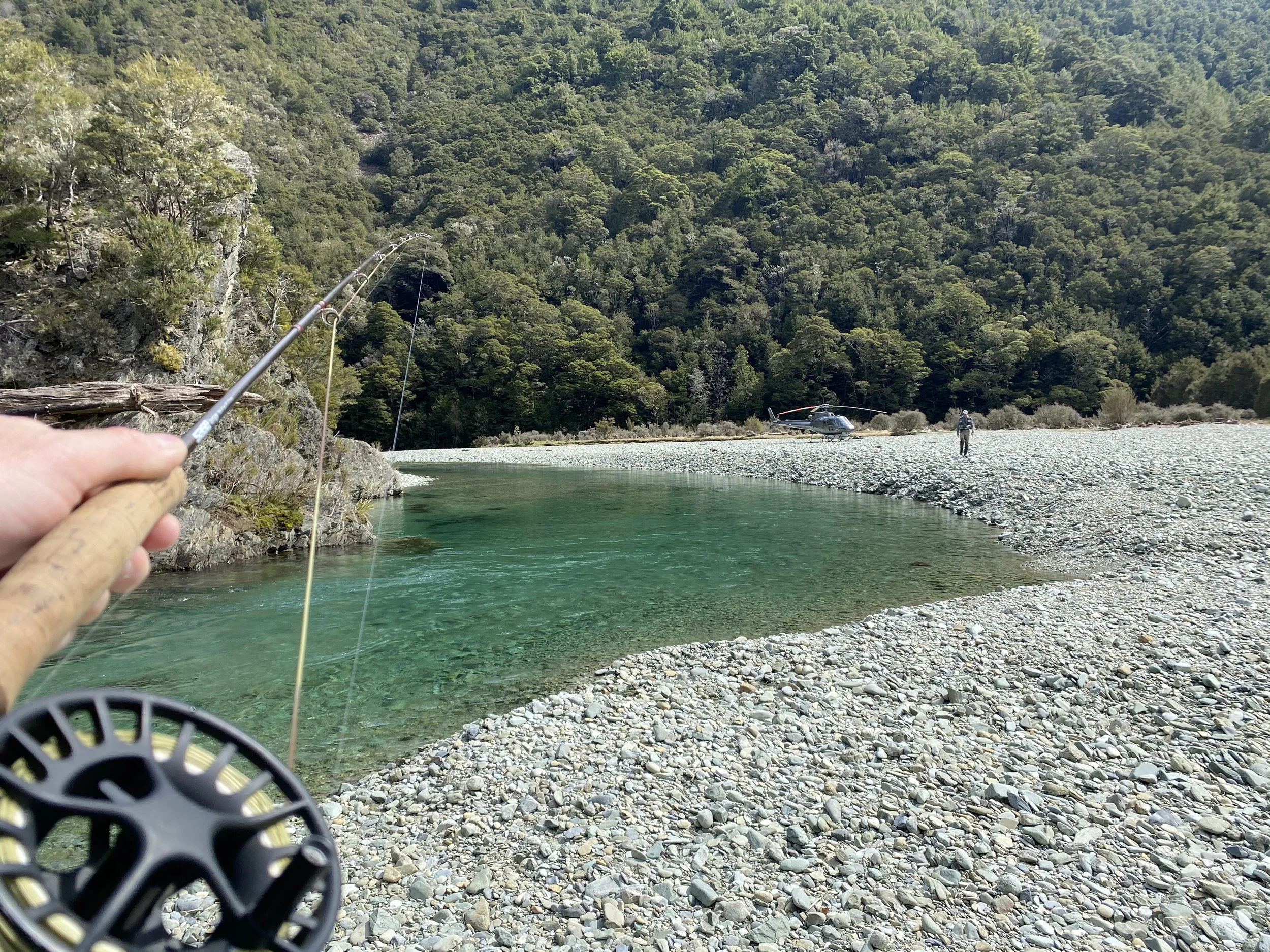 Fly rod and reel in action on Nelson backcountry river