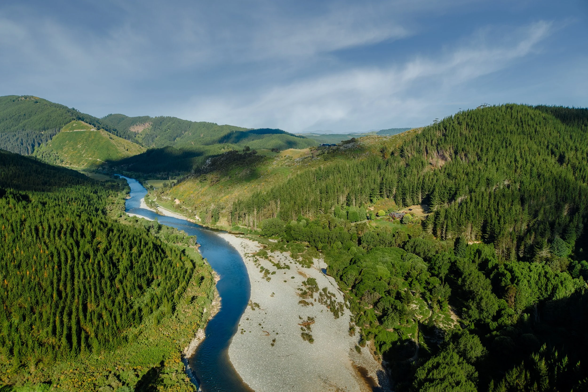 Aerial view of Motueka river winding through Nelson backcountry near Stonefly Lodge