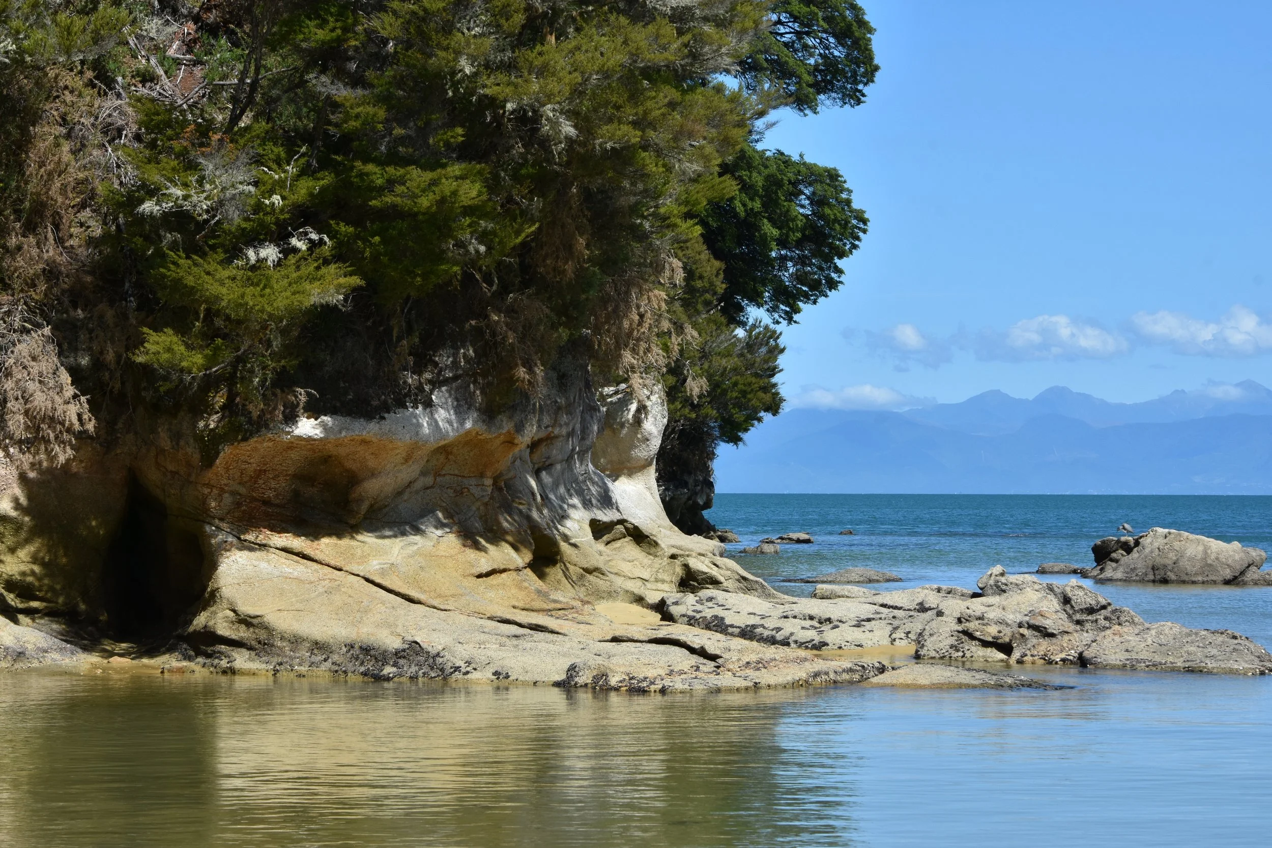 Kayaking along Abel Tasman coastline with Stonefly Lodge