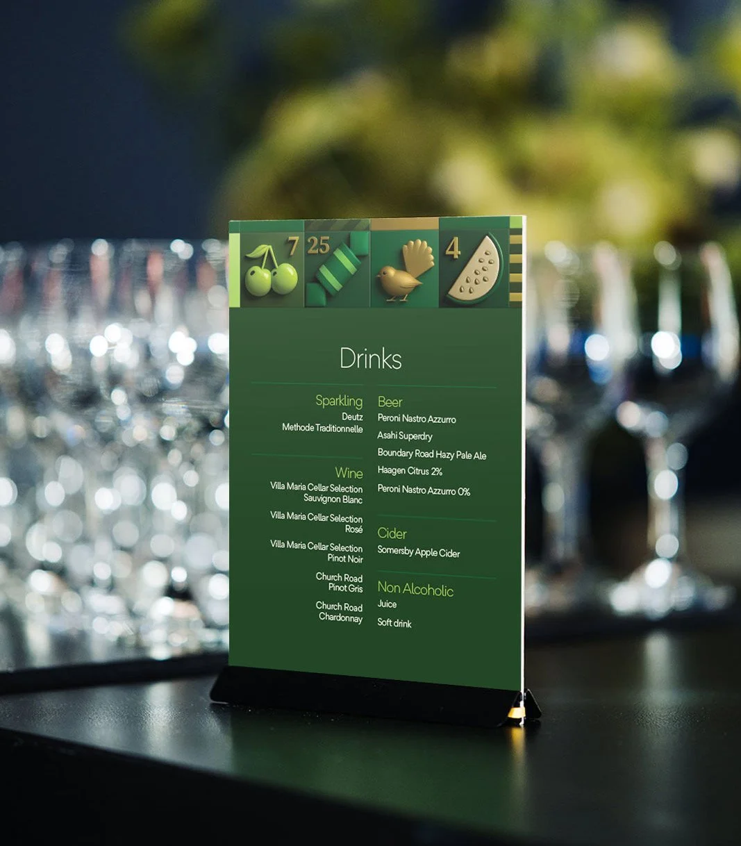 A menu board listing drinks including sparkling, beer, wine, cider, and non-alcoholic options, with icons of cherries, a mint leaf, a bird, and a watermelon slice at the top.