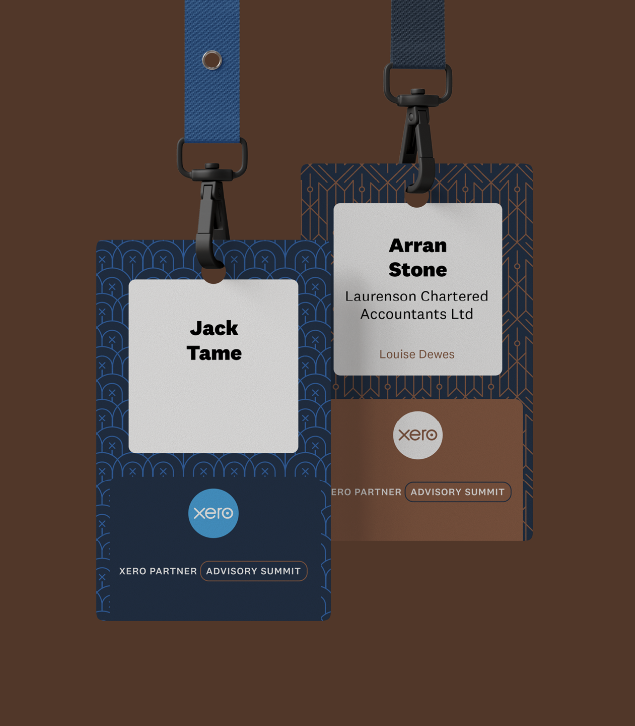 Two conference badges hanging on black clips, one labeled with the name 'Jack Tame' and the other with 'Arran Stone', attending the Xero Advisory Summit.