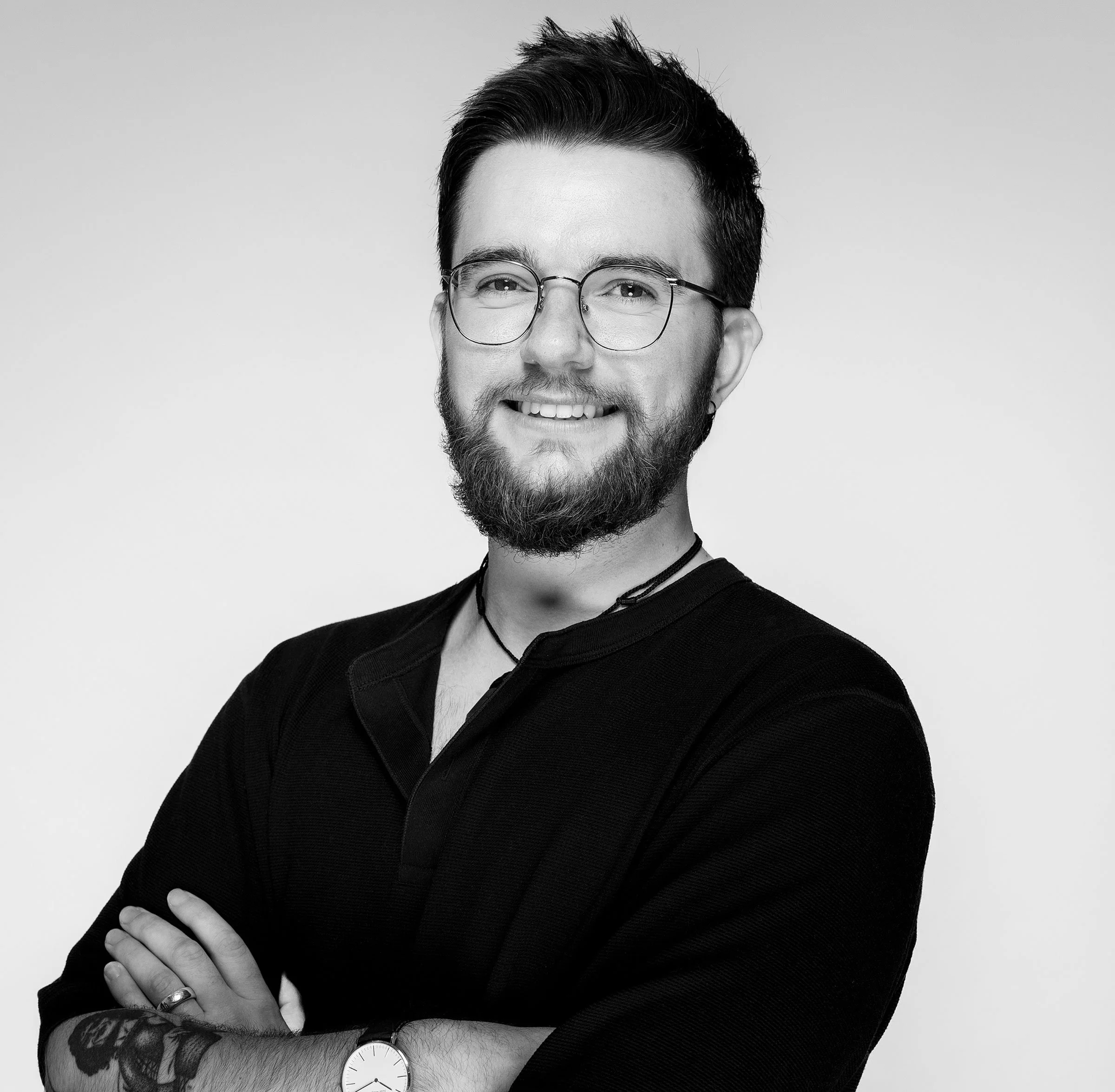 Black and white portrait of a man smiling