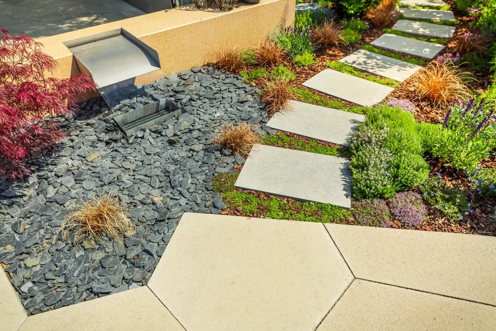 Natural stone walkway bordered with mulch as part of a xeriscape landscape design in Castle Rock, Colorado.