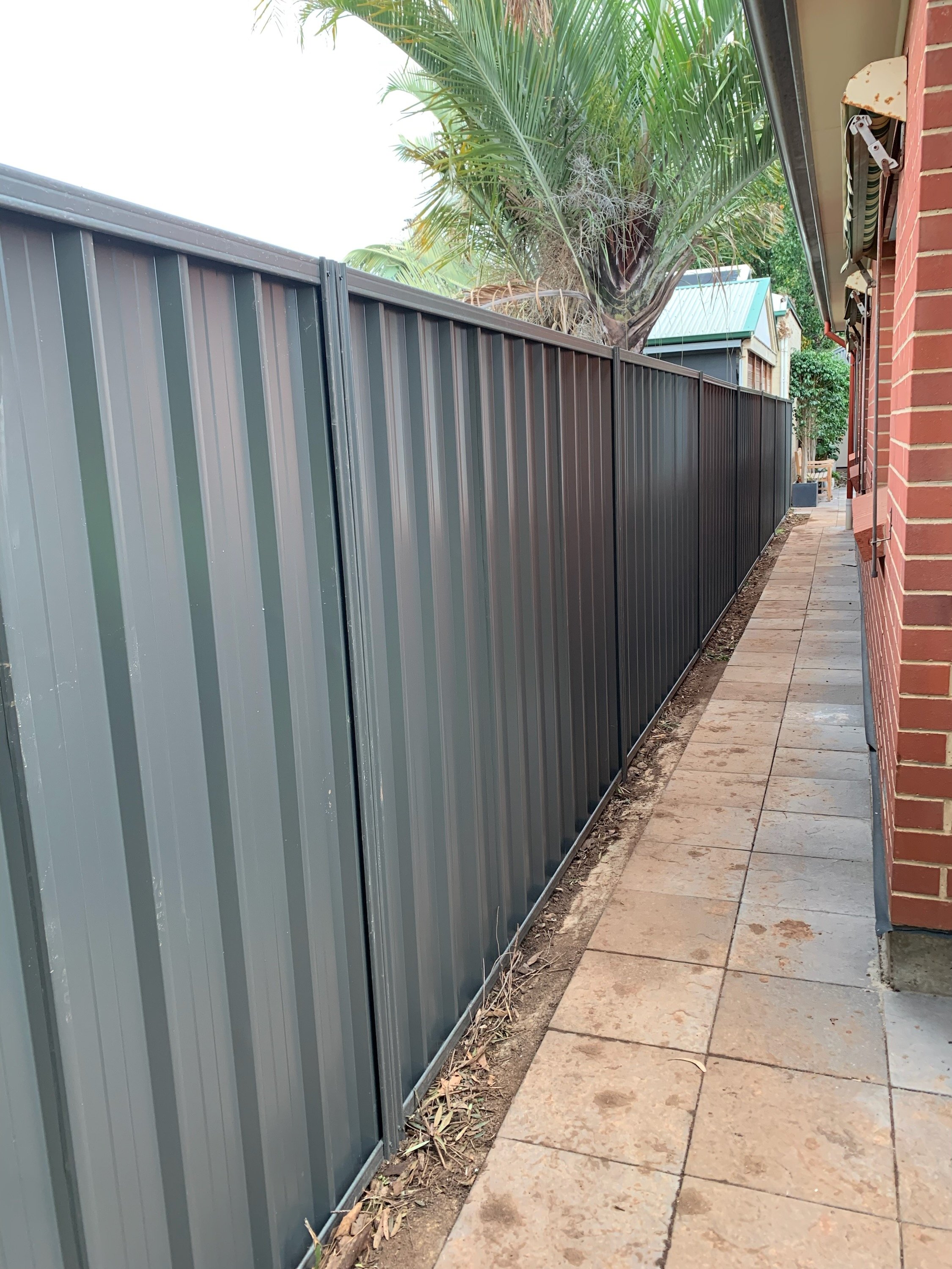 Colorbond Good Neighbour fence panels once installation has been completed.