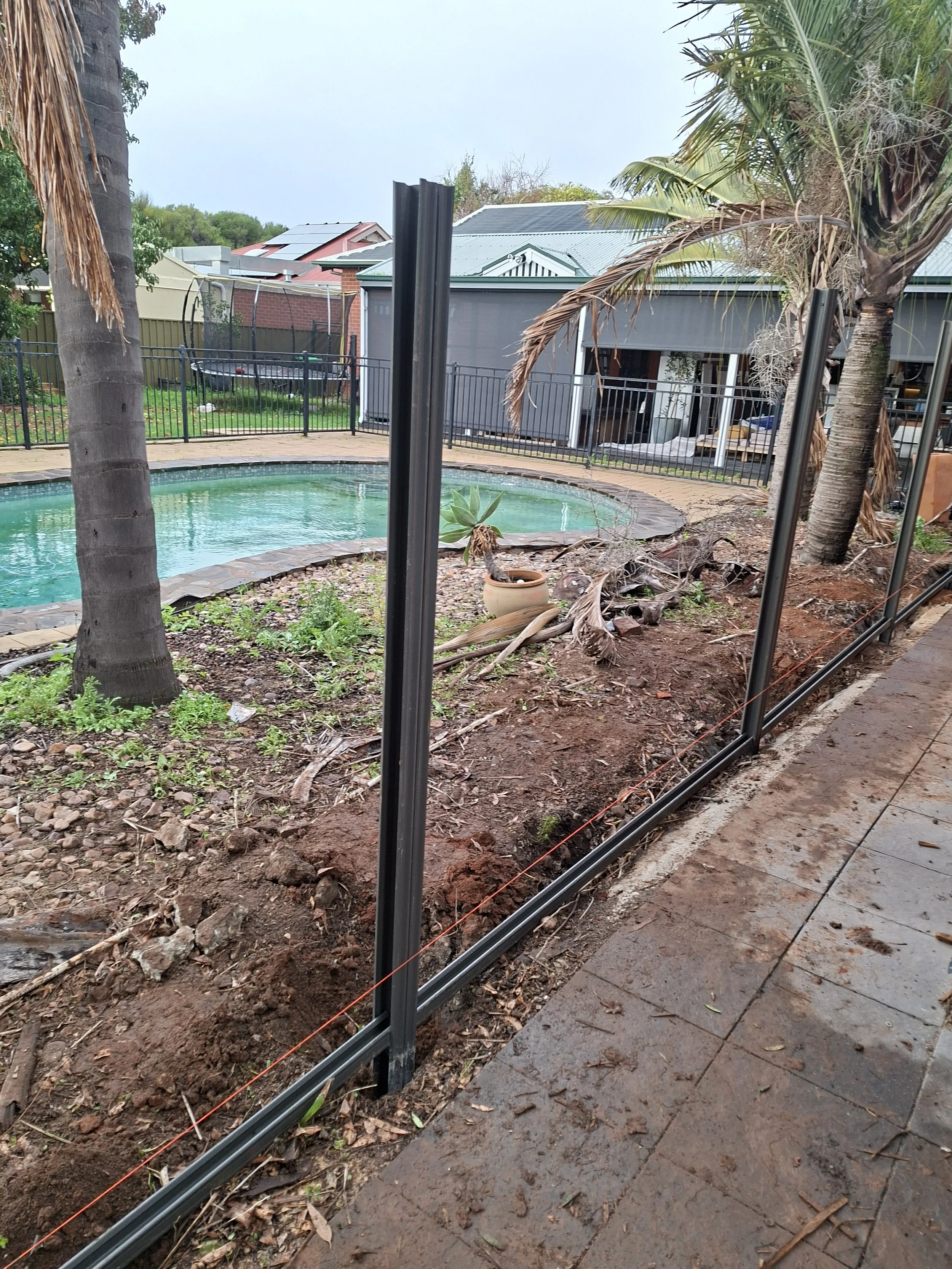 Installation of new fence posts and rails.